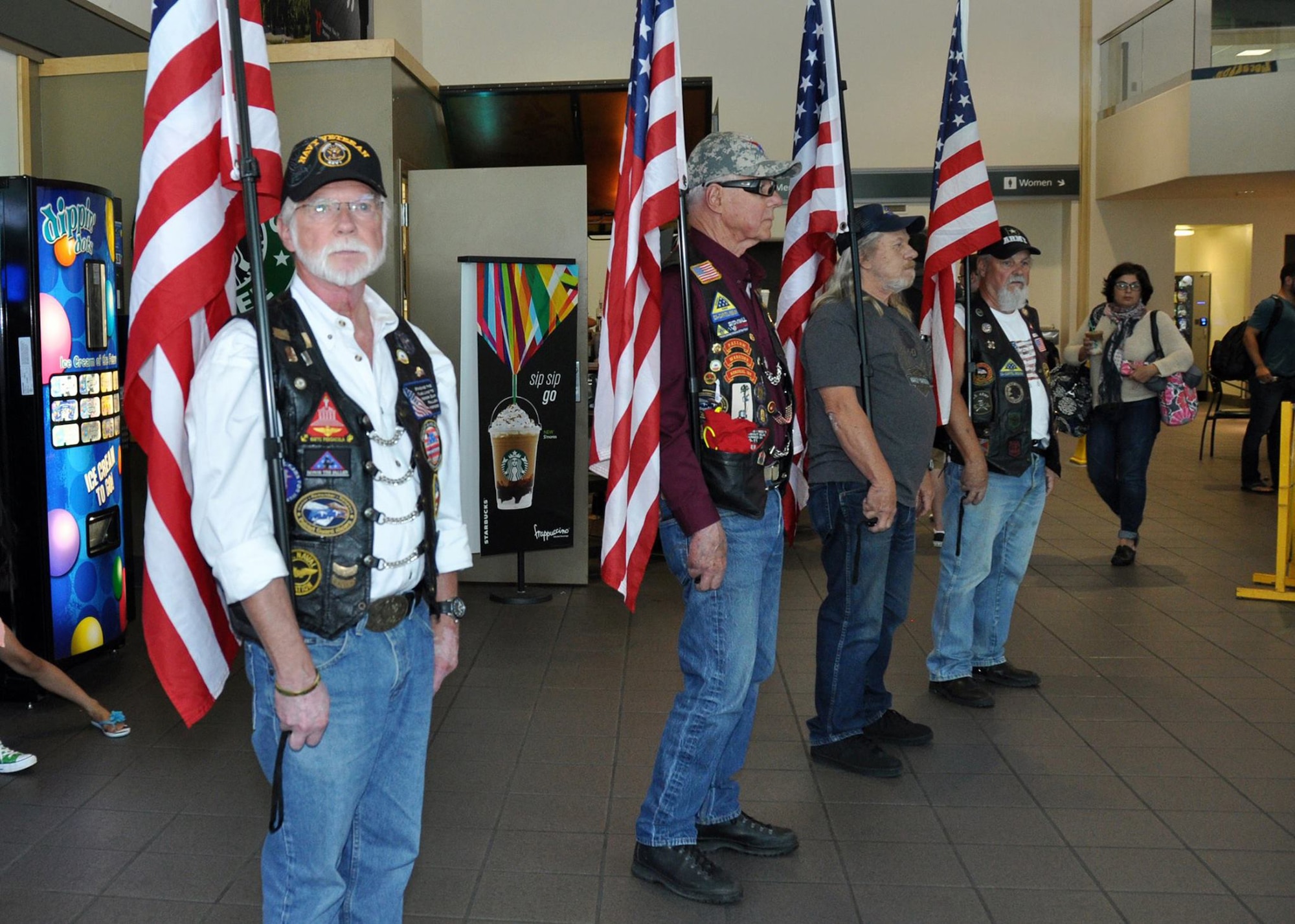 Members of Team Travis, military families and the Patriot Guard Riders of Sacramento welcome Security Forces Defender arriving at to the Sacramento International Airport after six-month deployments to Southwest Asia, May 3, 2015. The returning Airmen were from Travis Air Force Base’s 349th and 60th Security Forces Squadrons. (U.S. Air Force courtesy photo/Staff Sgt. Cindy G. Alejandrez/Released)