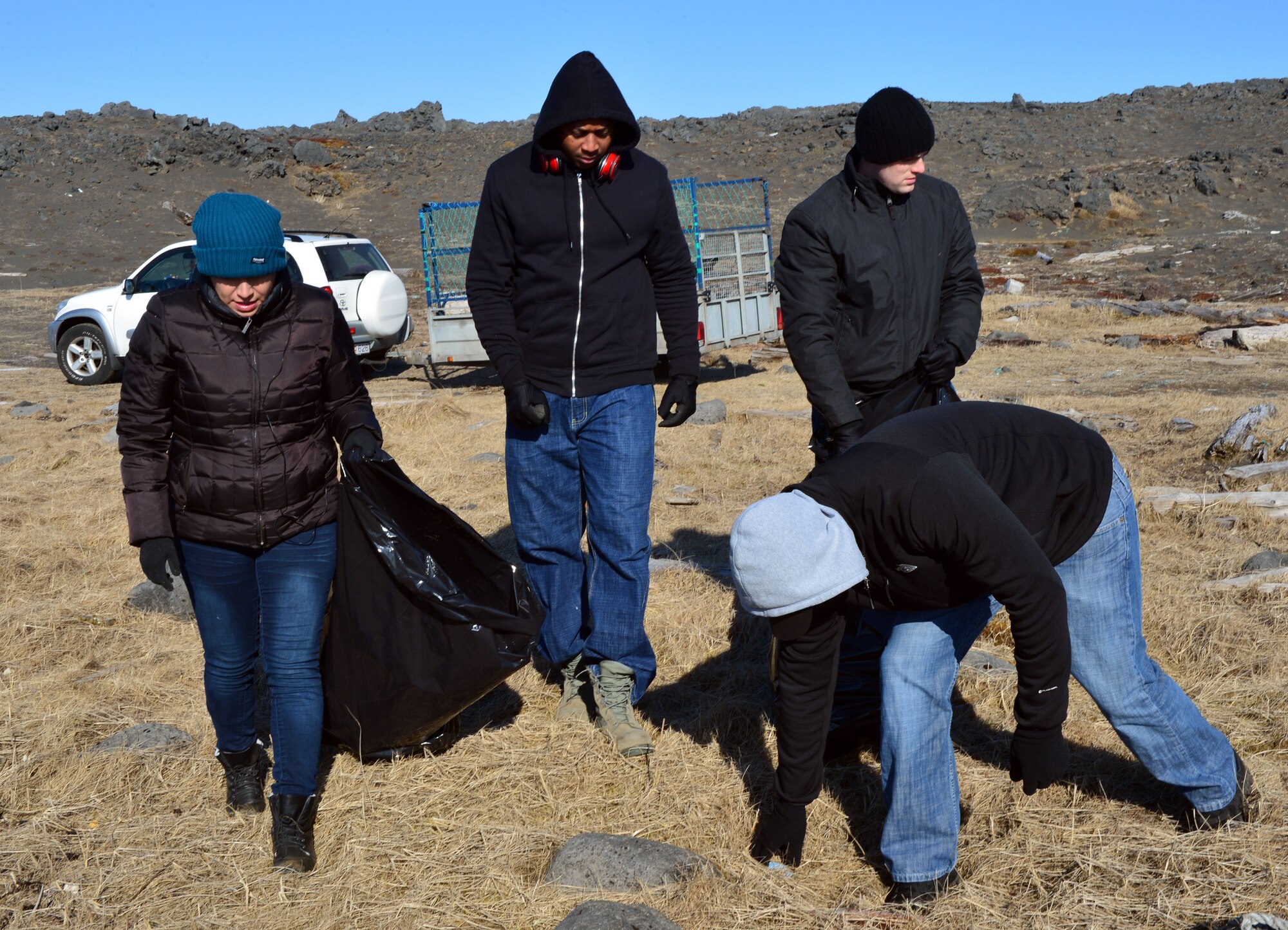 U.S. Airmen from the 871st Air Expeditionary Squadron search for debris during a beach clean-up on the Reykjanes Peninsula, Iceland, May 2, 2015.Airmen who deployed to Iceland for Icelandic Air Surveillance and Policing worked with members of the Blue Army, an Icelandic environmental organization, to clean up almost three tons of trash and debris along the coastline as a community service project. (U.S. Air Force photo by 2nd Lt Meredith Mulvihill/Released)