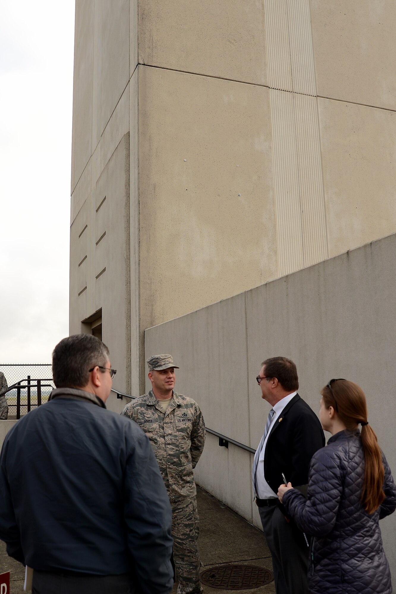 Senior Master Sgt. Carl Spatz, 62nd Operations Support Squadron chief tower controller, welcomes Congressman Denny Heck, WA-10, (second from right) to the McChord tower May 6, 2015, at Joint Base Lewis-McChord, Wash. The tower was one stop of many across JBLM for Heck as part of a community update brief. (U.S.  Air Force photo \ Staff Sgt. Tim Chacon)