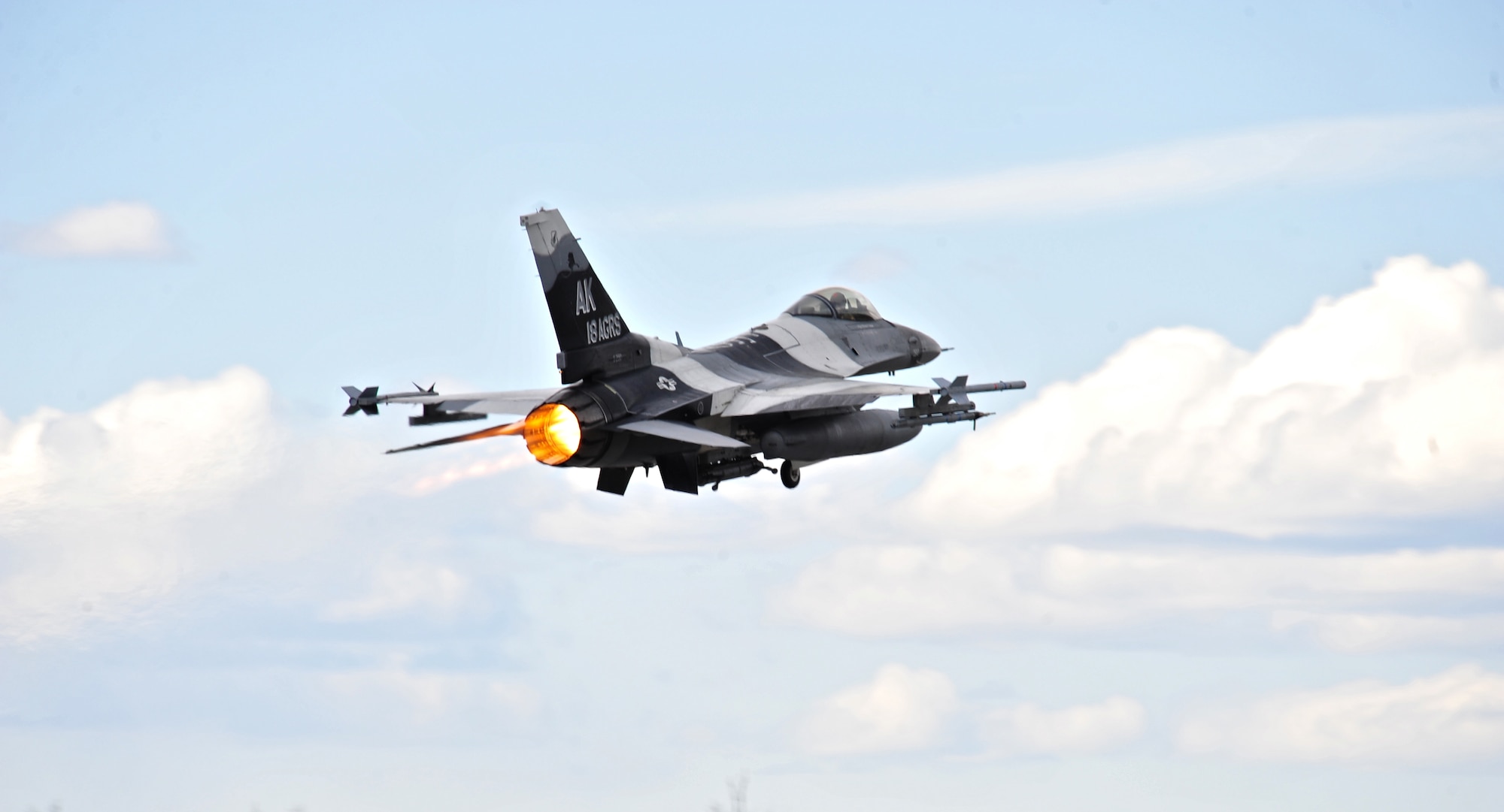 A U.S. Air Force F-16 Fighting Falcon aircraft with the 18th Aggressor Squadron flies during a RED FLAG-Alaska (RF-A) 15-2 mission May 5, 2015 over Eielson Air Force Base, Alaska, skies.  Aggressor pilots are trained to act as opposing forces in exercises like RF-A to better prepare U.S. and allied forces for aerial combat. (U.S. Air Force photo by Tech. Sgt. Miguel Lara III/Released)
