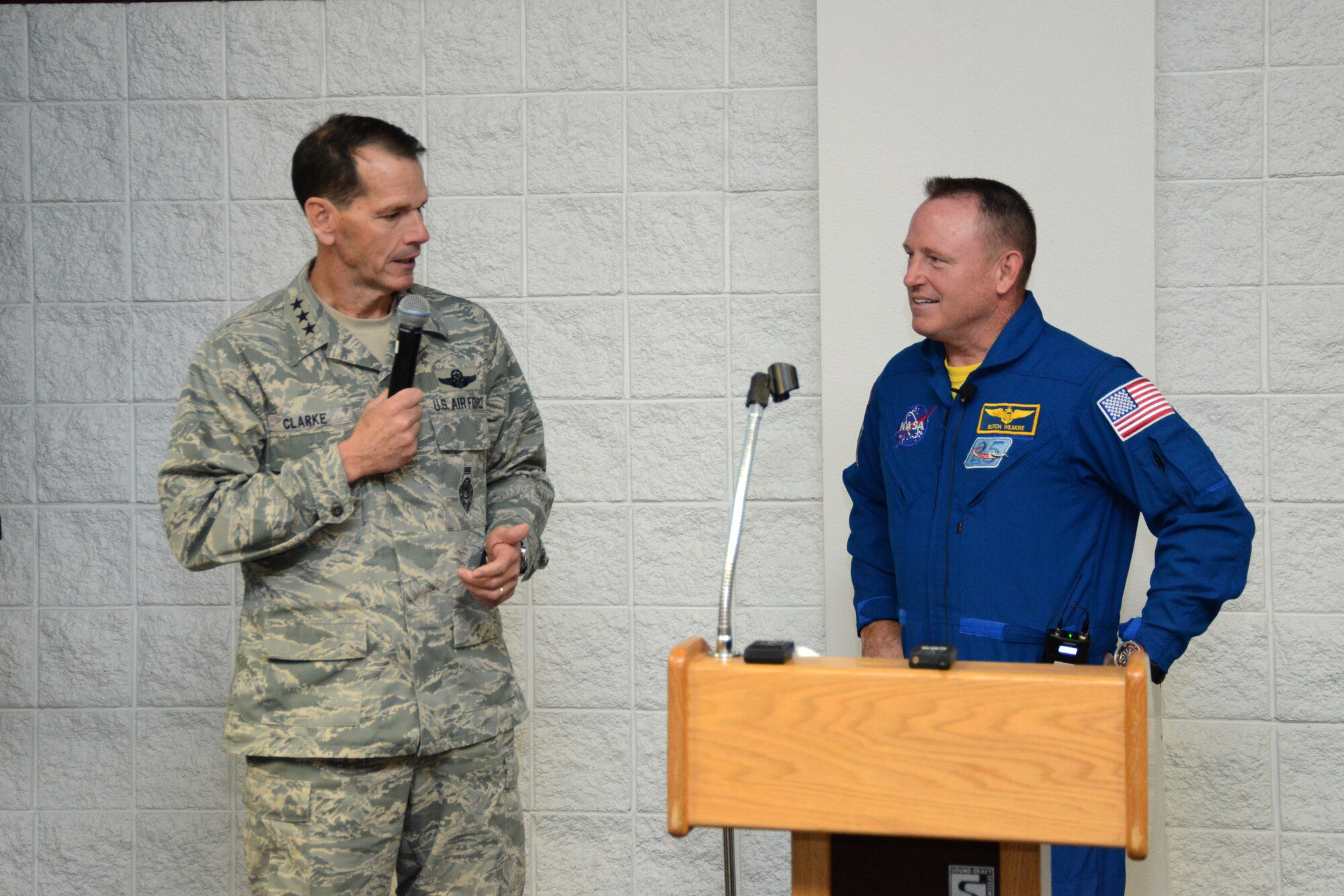 Director of the Air National Guard Lt. Gen. Stanley E. Clarke III, talks with NASA astronaut and US Navy Capt. Barry E. Wilmore about his experiences as commander of the International Space Station at the 2015 Air National Guard Executive Safety Summit at Volk Field Combat Readiness Training Center, Wisconsin, May 5, 2015. The conference covers a wide range of topics for ANG senior leaders including safety, resilience, mishap prevention and training. (US Air National Guard photo by Staff Sgt. John E. Hillier/RELEASED)