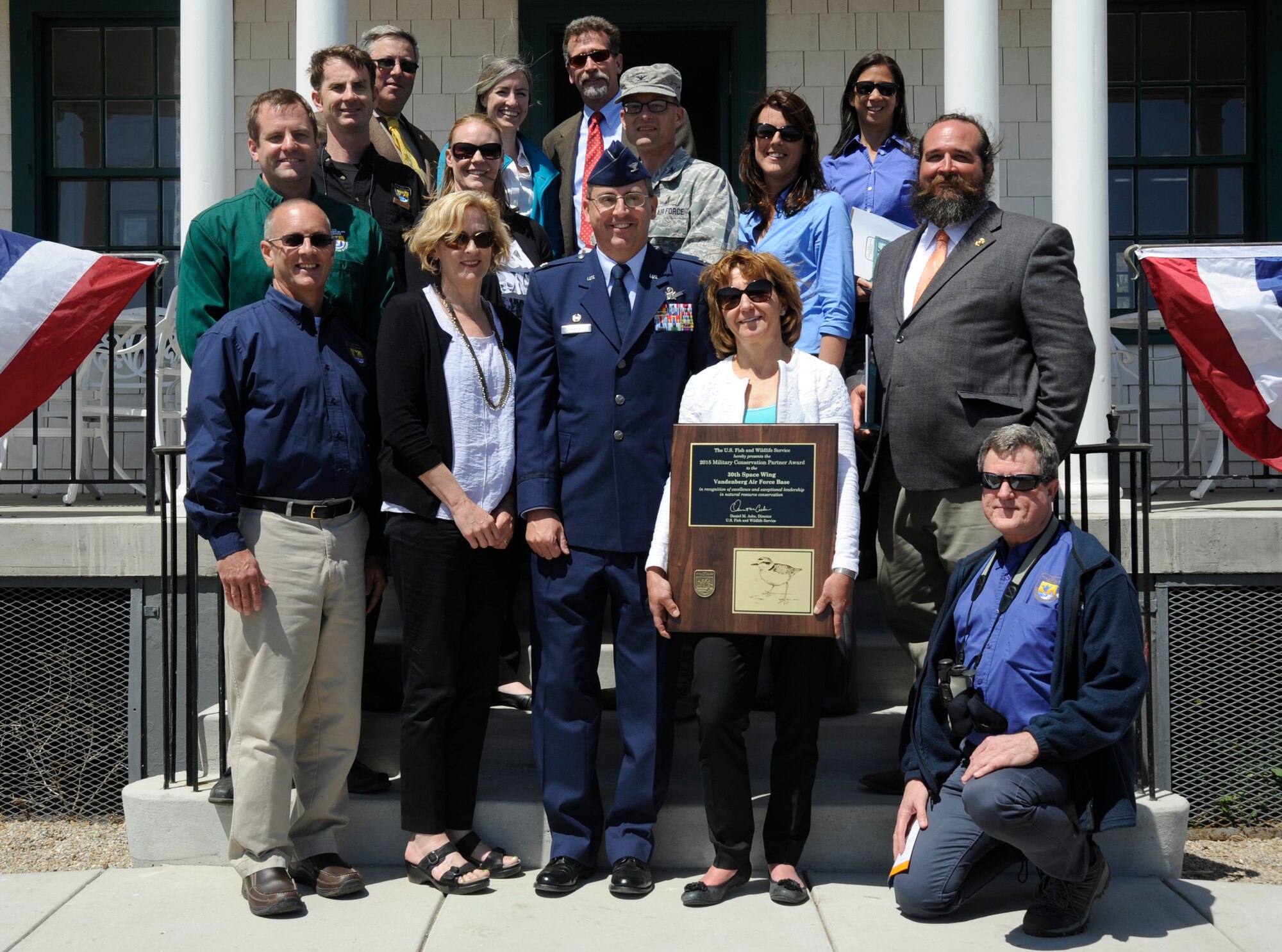 U.S. Fish and Wildlife representatives and Col. Keith Balts, 30th Space Wing commander, stand with Vandenberg’s award-winning conservation team May 4, 2015, Vandenberg Air Force Base, Calif. The conservation team received the U.S. Fish and Wildlife Partner of the Year Award for their efforts to conserve and restore endangered species and their habitats. (U.S. Air Force photo by Airman 1st Class Ian Dudley/Released)
