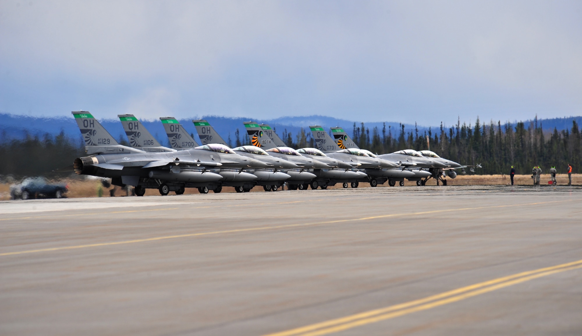U.S. Air Force F-16 Fighting Falcon aircraft assigned to the 112th Fighter Squadron, Toledo Air National Guard Base, Ohio, wait on the flightline May 5, 2015, prior to take off during RED FLAG-Alaska (RF-A) 15-2 at Eielson Air Force Base, Alaska.  On average, more than 1,000 people and up to 60 aircraft deploy to Eielson during the two-week exercise. (U.S. Air Force photo by Tech. Sgt. Miguel Lara III/Released)