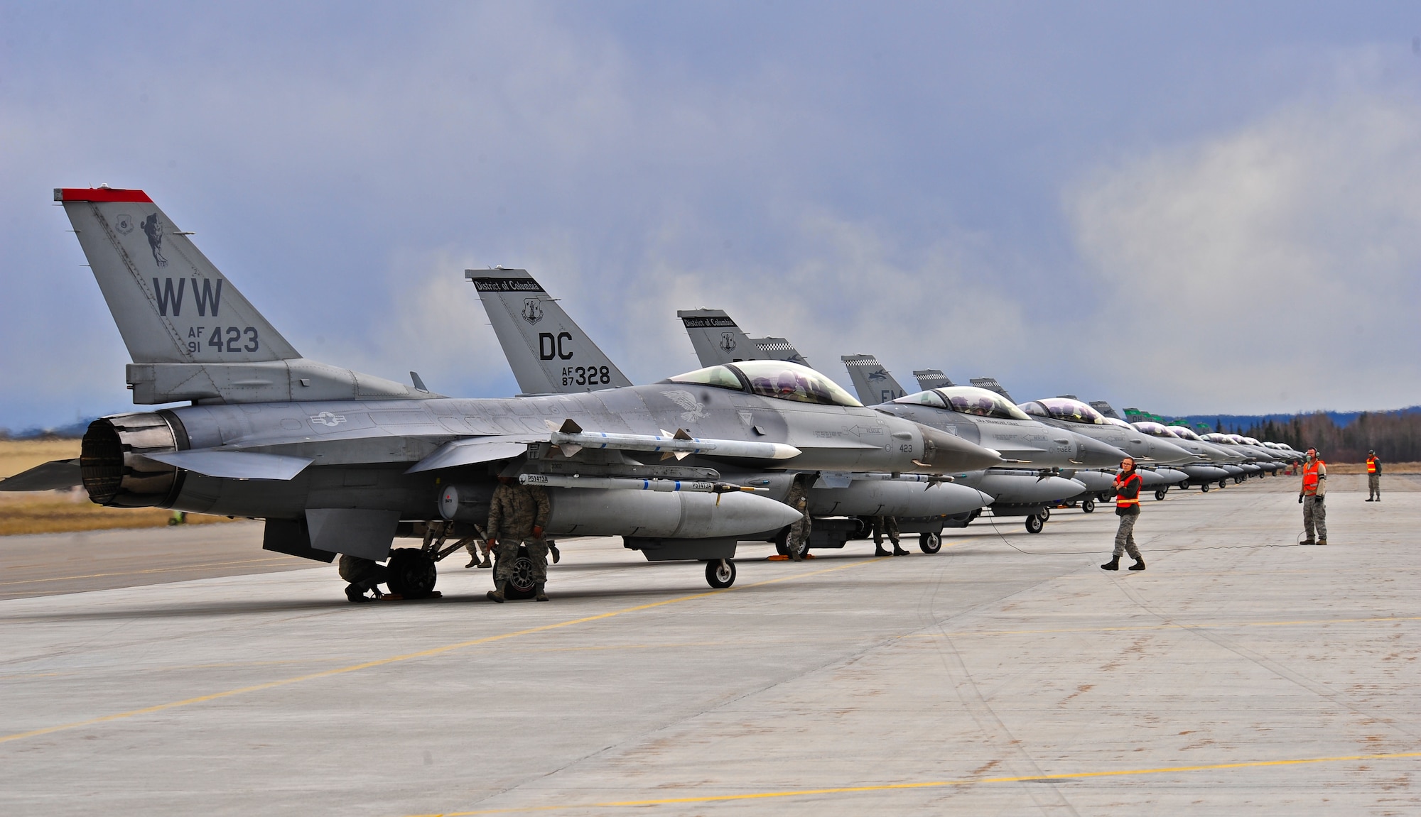 U.S. Air Force F-16 Fighting Falcon aircraft from various units prepare for final inspection on the flightline prior to take off May 5, 2015, during RED FLAG-Alaska (RF-A) 15-2 at Eielson Air Force Base, Alaska. RF-A enables joint and international units to sharpen their combat skills by flying simulated combat sorties in a realistic threat environment. (U.S. Air Force photo by Tech. Sgt. Miguel Lara III/Released)