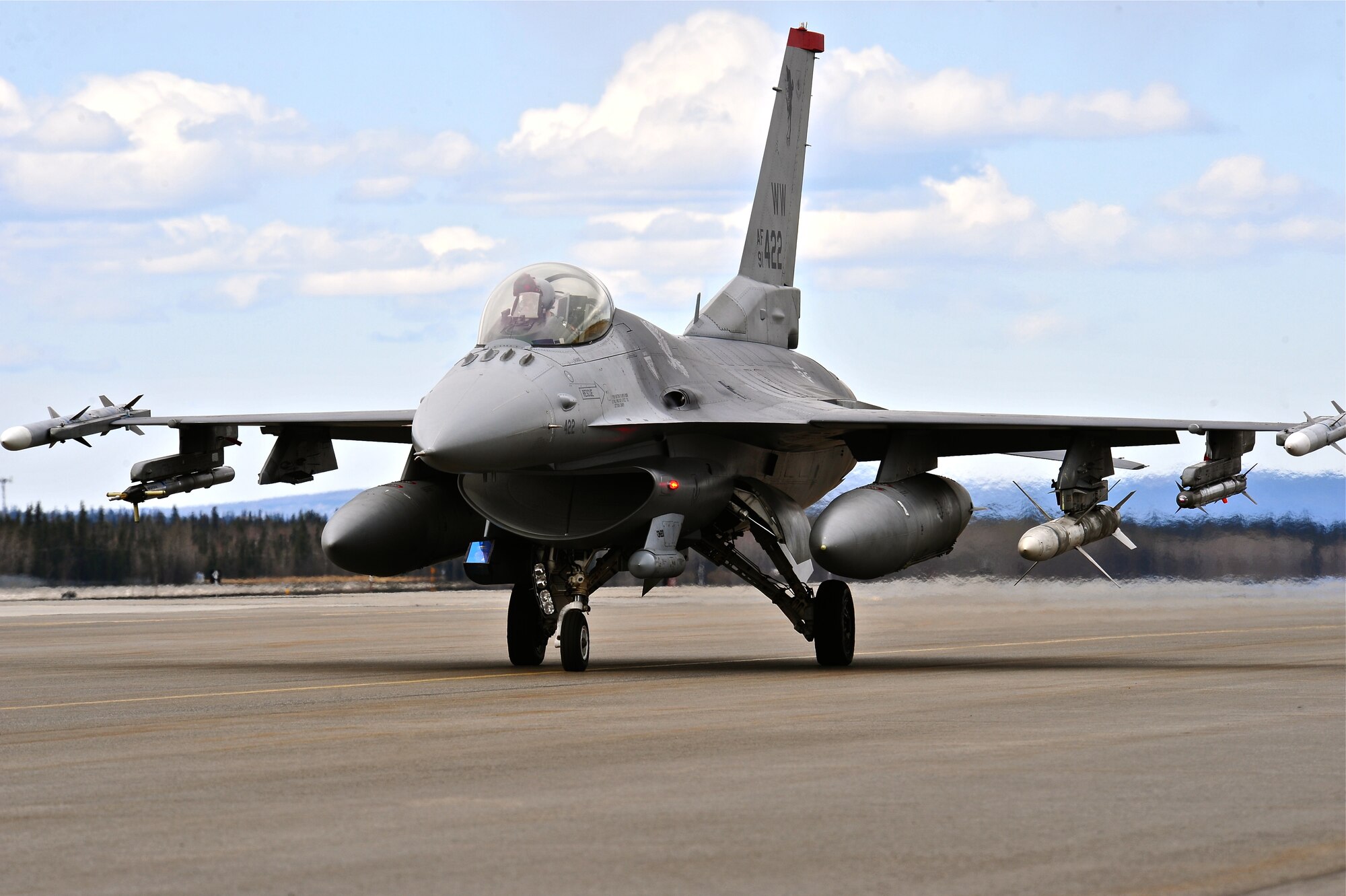 A U.S. Air Force F-16 Fighting Falcon aircraft assigned to the 13th Fighter Squadron, Misawa Air Base, Japan, taxis the flightline May 5, 2015, prior to take off during RED FLAG-Alaska (RF-A) 15-2 at Eielson Air Force Base, Alaska.  RF-A allows participating units to exchange tactics, techniques and procedures as well as improve interoperability. (U.S. Air Force photo by Tech. Sgt. Miguel Lara III/Released)