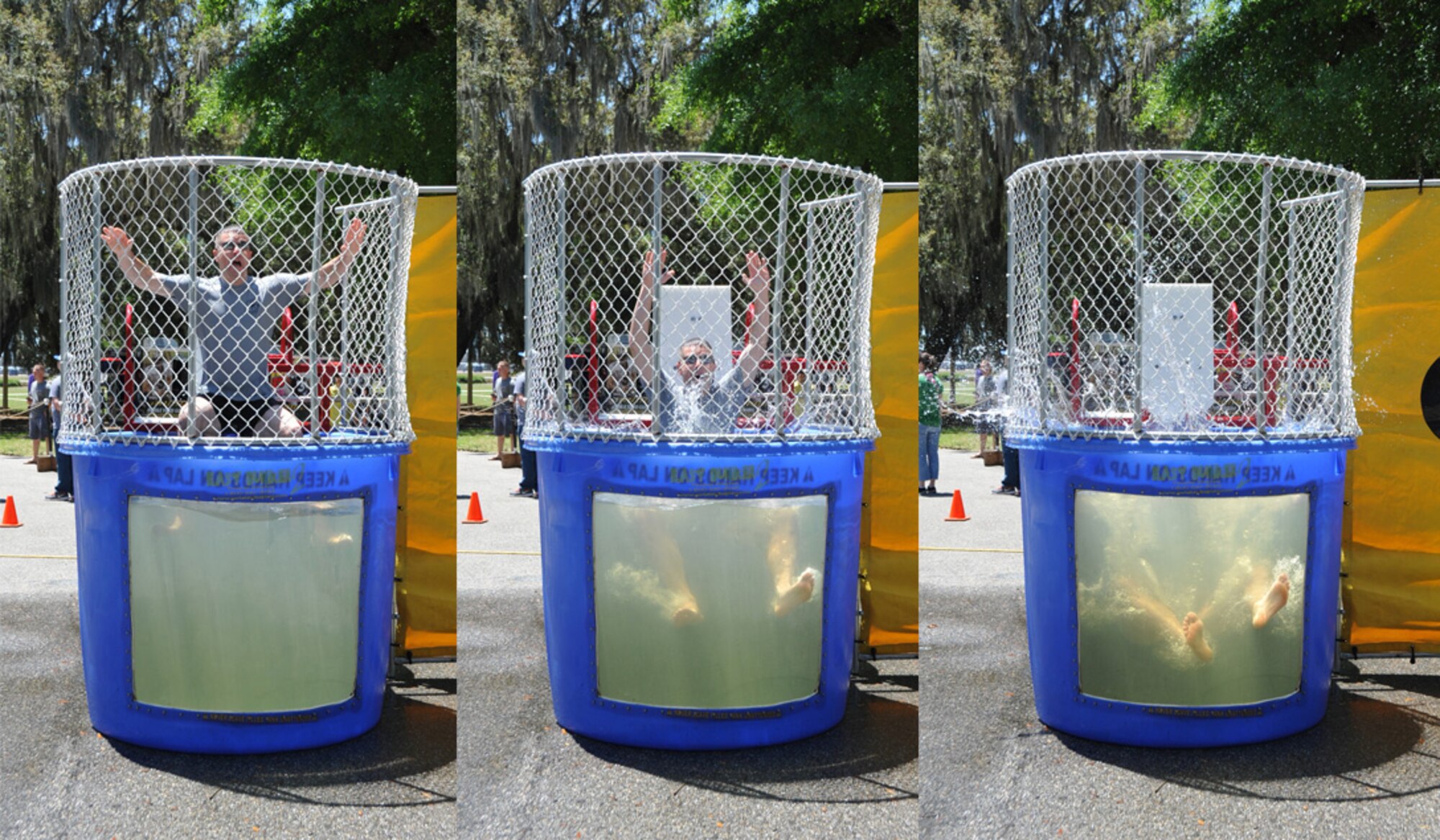 Col. Frank L. Amodeo, 403rd Wing commander, gets dunked during the 403rd Wing Airman and Family Day May 2, 2015, at Keesler Air Force Base, Mississippi.  (U.S. Air Force Photo Illustration/Master Sgt. Jessica Kendziorek)
