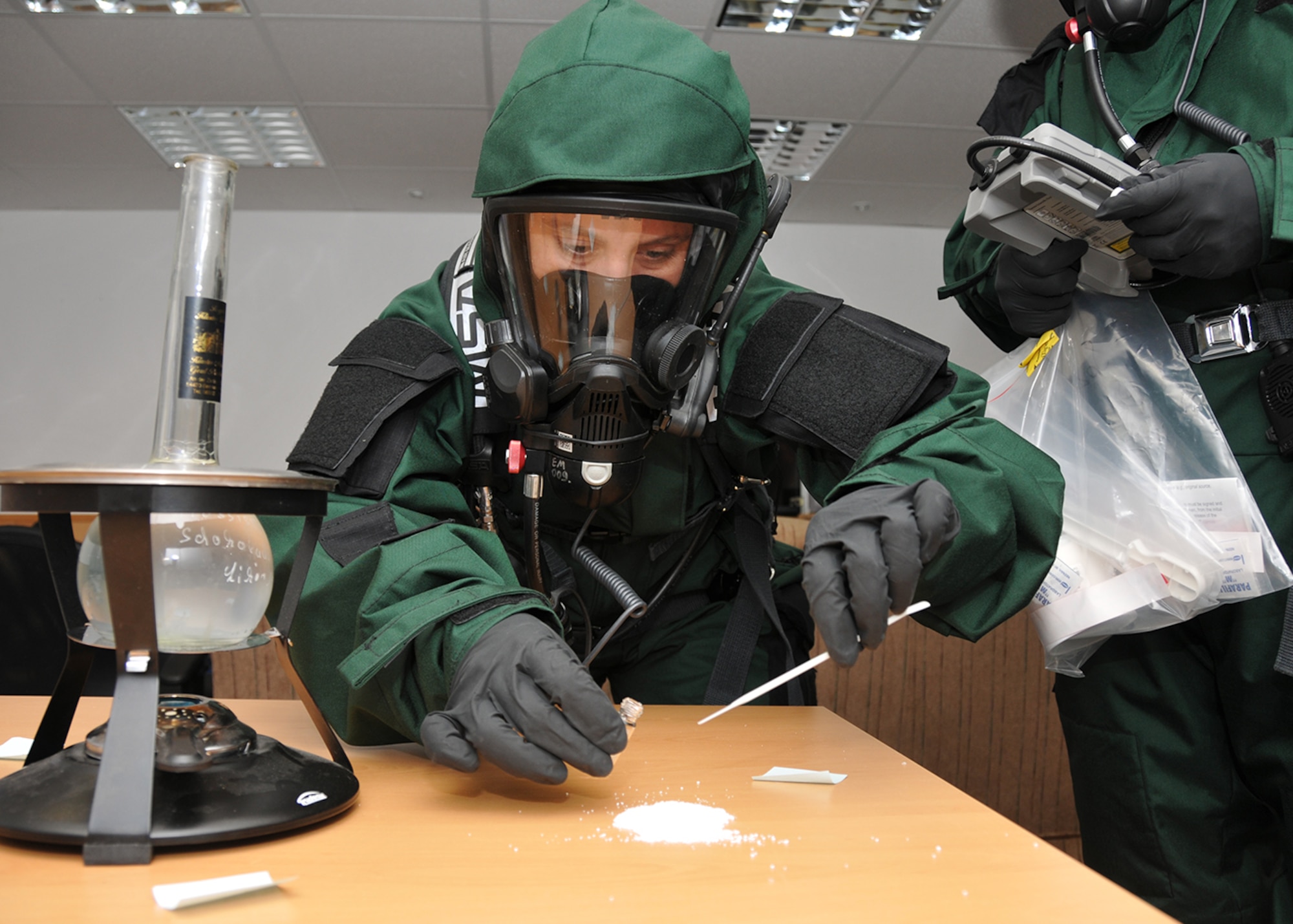 Tech. Sgt. Nicole Locke, 104th Emergency Management Flight, Barnes Air National Guard Base, Westfield, Mass., samples an unknown substance for testing during an exercise May 6, 2015, Spangdahlem Air Base, Germany. Locke is training on Active CBRNE (Chemical Biological Radiological Nuclear and High- Yield Explosives) Response with the active-duty members to enhance their Hazmat Technician Certification. This is a required training that needs to be done by the guard and the active duty. Doing the training together allows them to increase their knowledge by sharing their experiences and use different types of equipment. (U.S. Air National Guard photo by 2nd Lt. Bonnie Harper/Released) 
