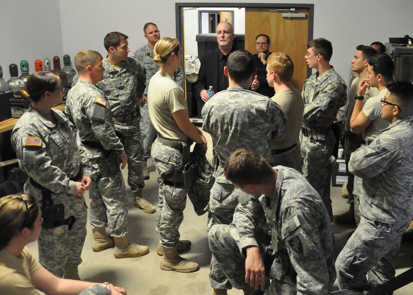 David Bolgiano(center), a teacher and author on deadly force encounters, provides feedback to U.S. Military Academy Cadets after a Firearms Training Simulator scenario May 2. The Cadets participated a two-day Judgment-based Engagement Training course provided by the U.S. Air Force Expeditionary Center Judge Advocate at Joint Base McGuire-Dix-Lakehurst. The 18 West Point Cadets also participated in classroom lectures and action and reaction scenarios to practice making lawful decisions in real-time.(U.S. Air Force photo/Capt. Matthew Chism)