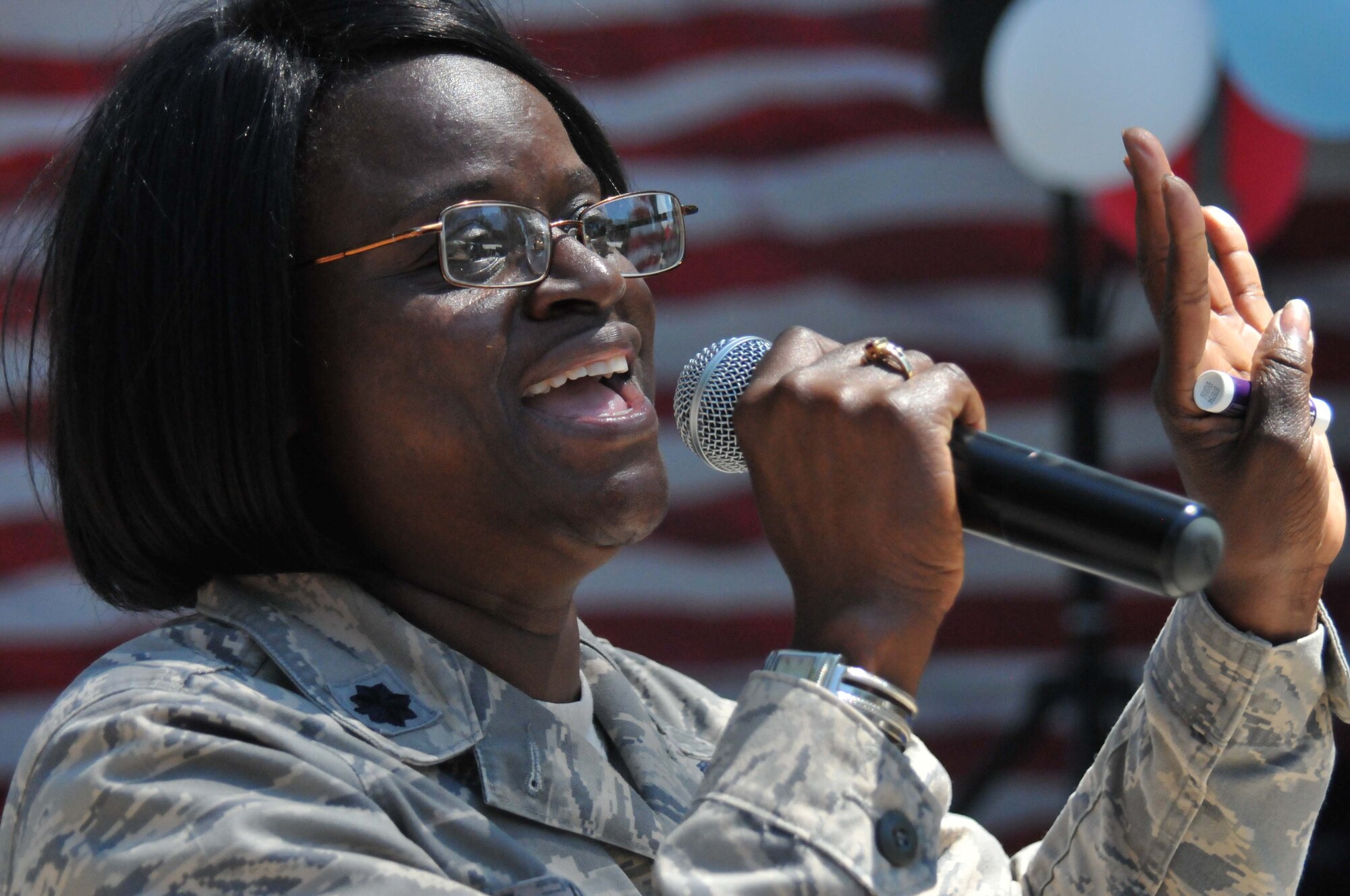 Lt. Col. Romaine Hatten, 403rd Aeromedical Staging Squadron mental health nurse, raps during a freestyle performance at the 403rd Wing Airman and Family Day event May 2, 2015, at Keesler Air Force Base, Mississippi. (U.S. Air Force Photo/Staff Sgt. Nicholas Monteleone)