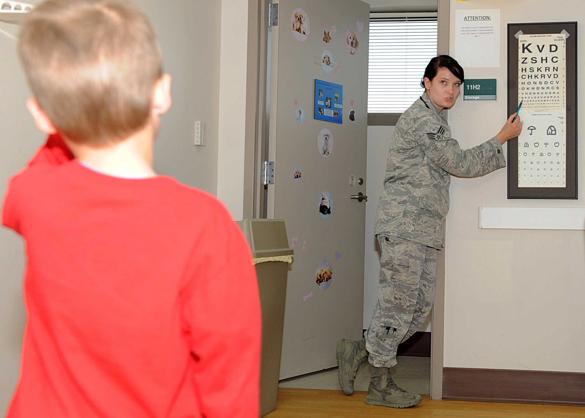Senior Airman Alicia Jacoby, 22nd Medical Operations Squadron pediatric
medical technician, administers an eye exam, April 8, 2015, at McConnell Air
Force Base, Kan. The eye exam was part of a routine check for the patient as
part of maintaining the overall health of McConnell Airmen and their
dependents. (U.S. Air Force photo by Senior Airman David Bernal Del Agua)

