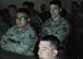 Cadet Tyler Korellis (center), U.S. Military Academy Class of 2015 from Munster, Ind., watches while another Cadet navigates a Firearms Training Simulator scenario led by Senior Airmen Erick Alvarado and Rodney Mueller, 621st Contingency Response Wing, May 2. The Cadets visited Joint Base McGuire-Dix-Lakehurst to take part in a two-day Judgment-based Engagement Training course provided by the U.S. Air Force Expeditionary Center Judge Advocate May 2. The 18 West Point Cadets also participated in classroom lectures and action and reaction scenarios to practice making lawful decisions in real-time.(U.S. Air Force photo/Capt. Matthew Chism)