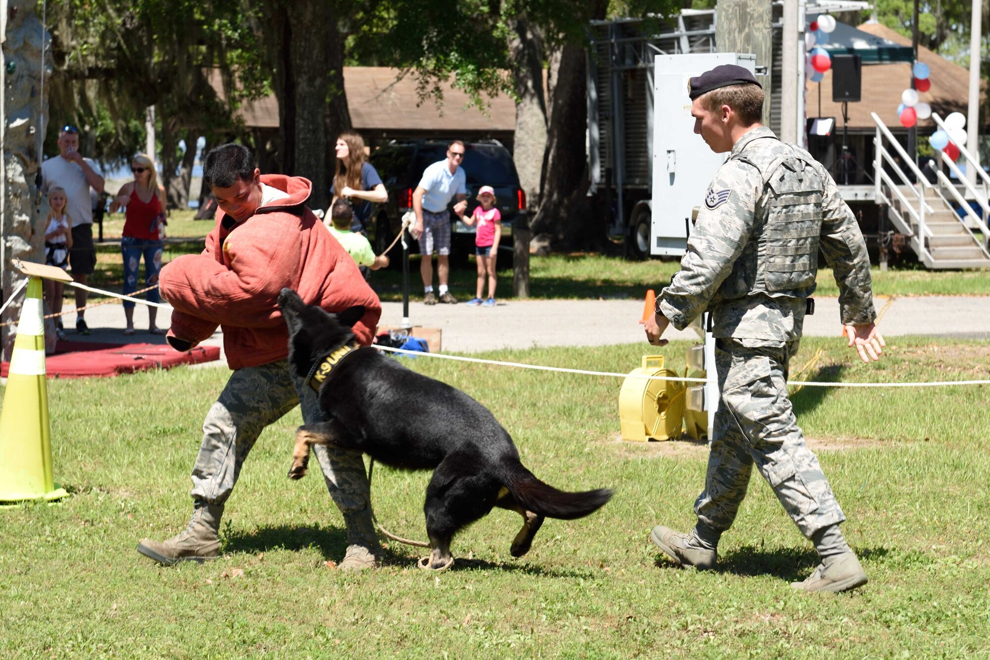 Staff Sgt. Jordan Lieter, 81st Security Forces Squadron military working dog handler, releases Ares, a Belgian Malinois military working dog, onto Senior Airman Matthew Ratchford, 81st SFS military working dog handler, during a demonstration at the 403rd Wing Airman and Family Day May 2, 2015, at Keesler Air Force Base, Mississippi. (U.S. Air Force Photo/Tech. Sgt. Ryan Labadens)