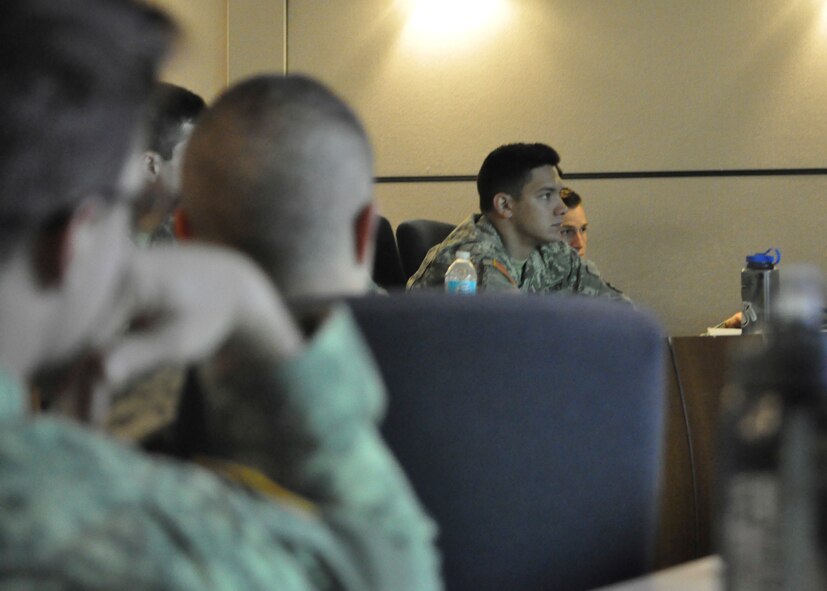 Cadet Nathan Degen, U.S. Military Academy Class of 2015 from Arlington, Texas, listens during a briefing on ethics at the U.S. Air Force Expeditionary Center May 2. U.S. Military Academy Cadets visited Joint Base McGuire-Dix-Lakehurst to take part in a two-day Judgment-based Engagement Training course provided by the U.S. Air Force Expeditionary Center Judge Advocate. The 18 West Point Cadets participated in classroom lectures, a Firearms Training Simulator, and action and reaction scenarios to practice making lawful decisions in real-time.(U.S. Air Force photo/Capt. Matthew Chism)