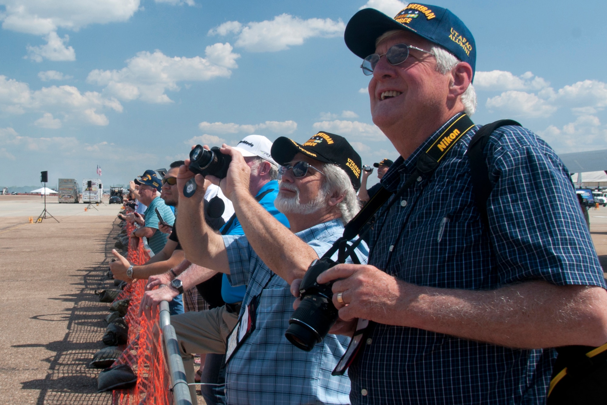 Veterans of the 307th Bomb Wing watch intently as the U.S. Navy Flight Demonstration Squadron, The Blue Angels, conduct a practice performance at Barksdale Air Force Base, La., May 1, 2015.   The veterans, all of whom served at U-Tapao Royal Thai Navy Airfield during the Vietnam War, were at Barksdale AFB for a reunion.  (U.S. Air Force photo by Tech. Sgt. Ted Daigle/Released)