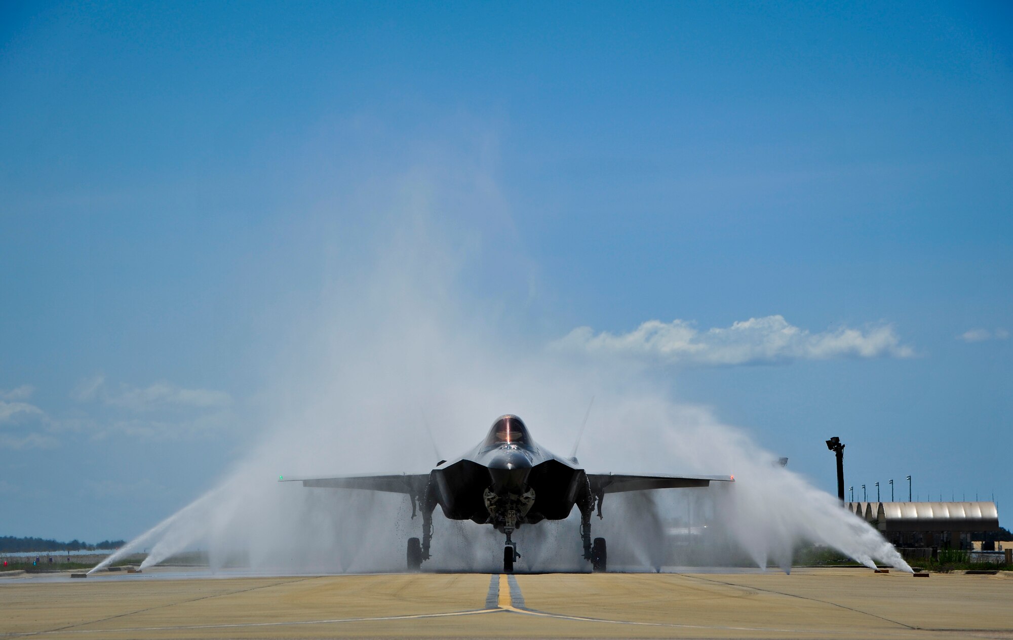 Lt. Col. Christine Mau, 33rd Operations Group deputy commander, navigates her F-35A through the “bird bath” after returning from her first flight on Eglin Air Force Base, Fla., May 5, 2015. Mau, who previously flew F-15E Strike Eagles, made history as the first female F-35 pilot in the program. (U.S. Air Force photo/Staff Sgt. Marleah Robertson)