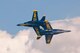 Members of the U.S. Navy Flight Demonstration Team Blue Angels perform the Opposing Knife Edge maneuver during the 2015 Defenders of Liberty Air Show at Barksdale Air Force Base, Louisiana, May 2. As the F/A-18 Hornets approach centerpoint, the pilots roll their aircraft into a 90 degree angle bank and push forward the stick, experiencing the sensation of weightlessness or ballistic flight, similar to that experienced by astronauts in space. (U.S. Air Force photo by Master Sgt. Jeff Walston)