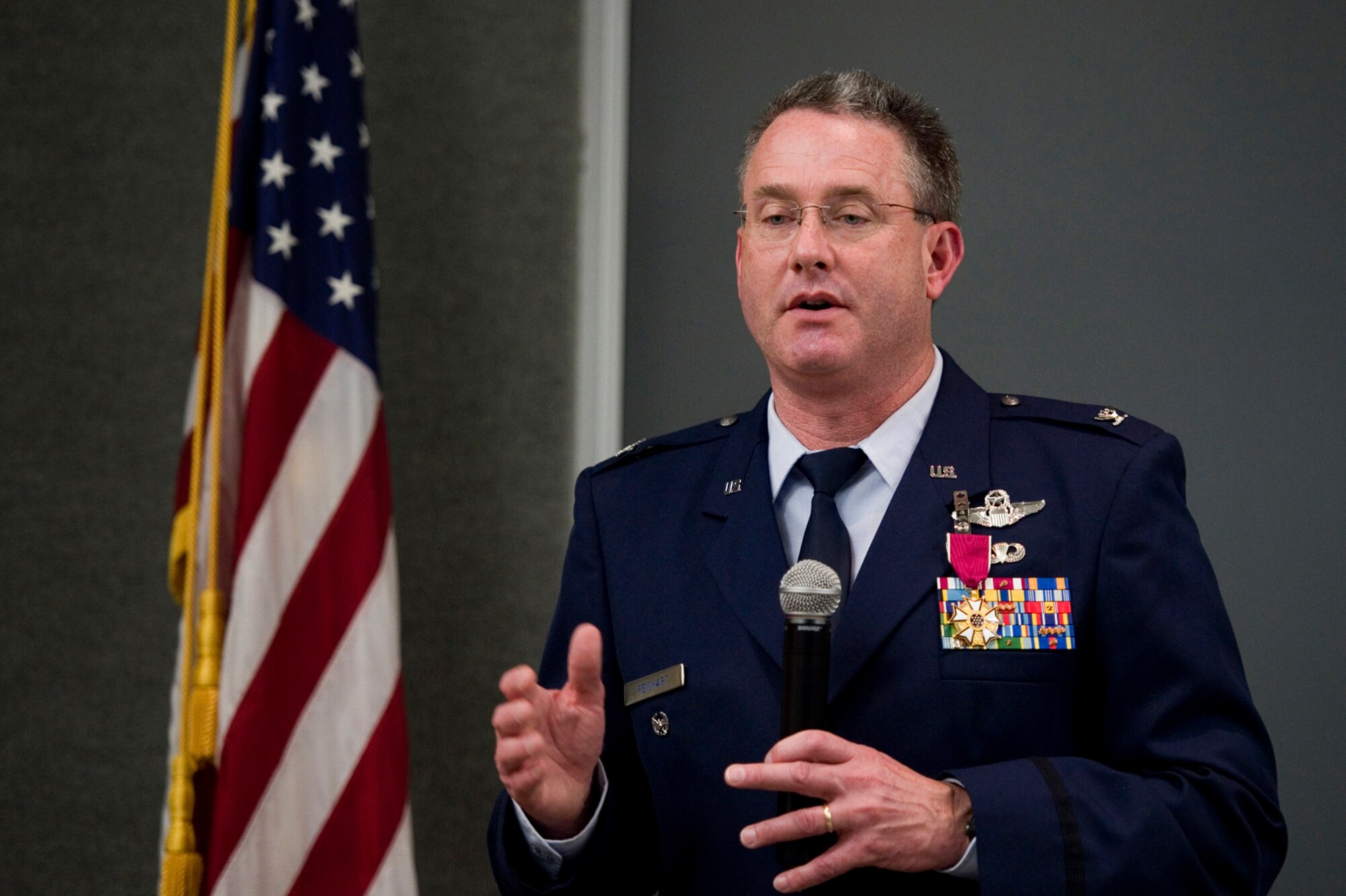 Col. Bryan Reinhart, 434th Air Refueling Wing vice commander, speaks to friends and family, thanking them for their support of his military service during his retirement ceremony at Grissom Air Reserve Base, Ind., April 11, 2015. During the ceremony Reinhart was awarded the Legion of Merit in addition to his retirement certificate after more than 34 years of military service. (U.S. Air Force photo/Tech. Sgt. Benjamin Mota)