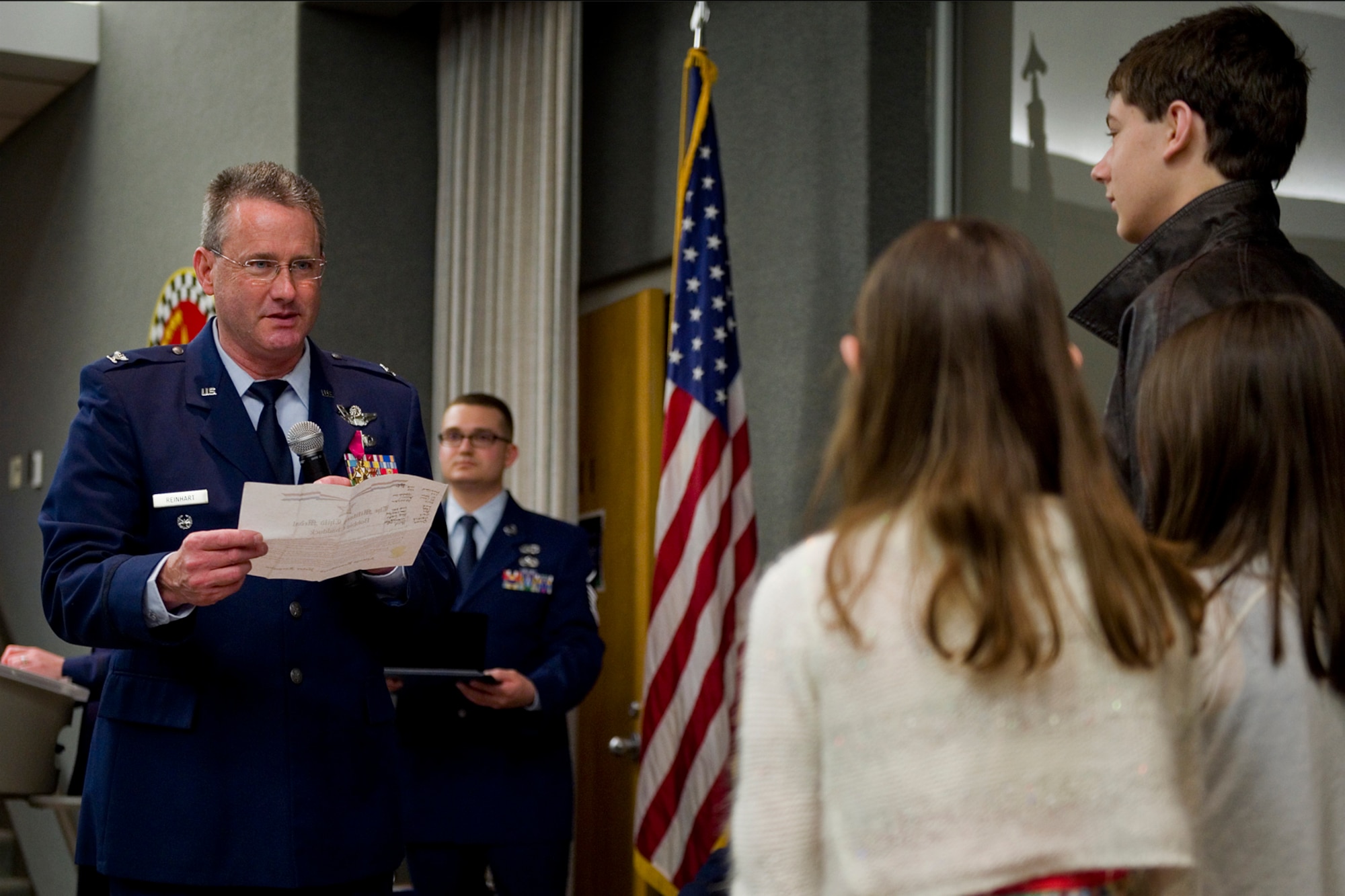 Col. Bryan Reinhart, 434th Air Refueling Wing vice commander, thanks his children, William, Ashley and Katey, for their support throughout his military career during his retirement ceremony at Grissom Air Reserve Base, Ind., April 11, 2015. Reinhart is a command pilot with more than 3,500 flying hours and a commercial pilot in his civilian capacity. (U.S. Air Force photo/Tech. Sgt. Benjamin Mota)