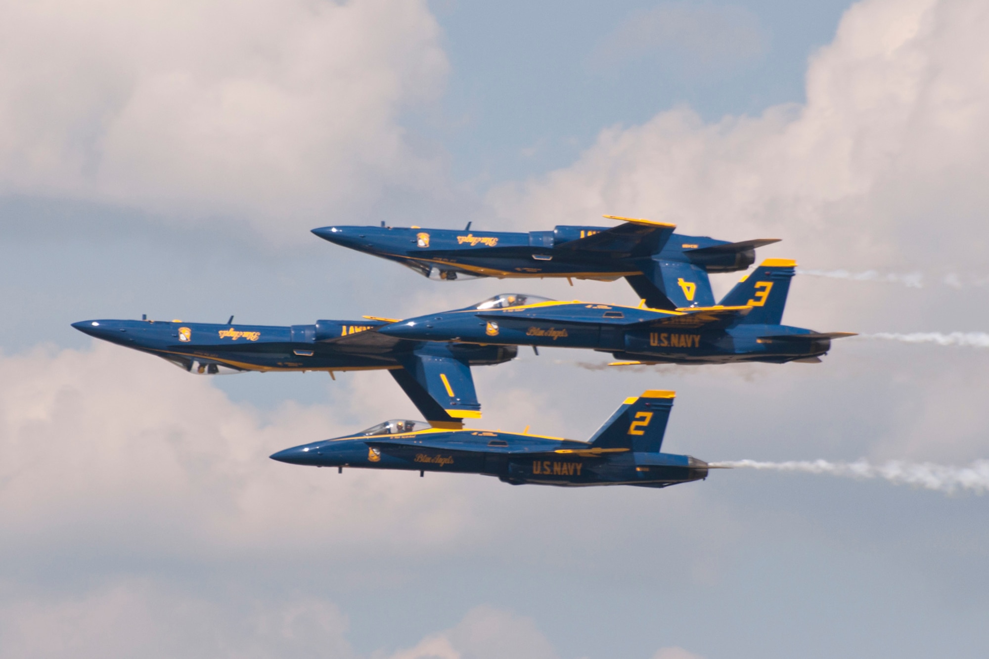 Members of the U.S. Navy Flight Demonstration Team Blue Angels perform one of their most difficult maneuvers during the 2015 Defenders of Liberty Air Show at Barksdale Air Force Base, Louisiana, May 2. The flight leader and slot pilot roll inverted and move into the Diamond formation for the Double Farvel maneuver. (U.S. Air Force photo by Master Sgt. Jeff Walston)