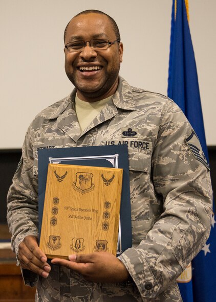 Master Sgt. Narvin Stewart, 919th Special Operations Communications Squadron, displays his plaque as second quarter outstanding senior noncommissioned officer May 3 at Duke Field, Fla.  Quarterly awards recognize individuals that exhibit high standards of performance through leadership and job performance, significant self-improvement, and base or community involvement. (U.S. Air Force photo/Tech. Sgt. Cheryl Foster)