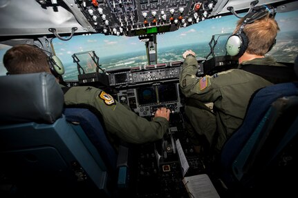 Col. John Lamontagne, 437th Airlift Wing commander, and Capt. Timothy Birt, 17th Airlift Squadron pilot, prepare to perform a flyover May 5, 2015, above Joint Base Charleston, S.C. A JB Charleston aircrew made up of members from the 437th Airlift Wing, 315th Airlift Wing and a Boeing Team flew this ceremonial flight commemorating the 3,000,000 flying hour milestone for the entire C-17 fleet. (U.S. Air Force photo/Airman 1st Class Clayton Cupit)