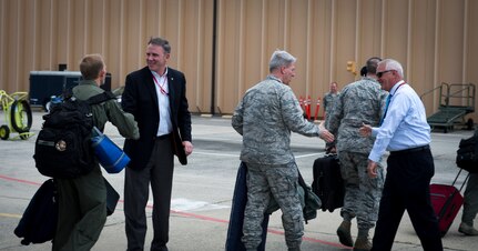 Maj. Gen. (ret) Robert McMahon, Boeing director of Field Operations, and Mr. Danny Singleton, deputy C-17 System Program director, welcomes the Charleston crew as they exit a C-17 Globemaster III May 4, 2015, on the flightline at Robins Air Force Base, Ga. A ceremony was held at Robins AFB and Joint Base Charleston, S.C., to commemorate this historic milestone for the C-17 fleet. As part of the ceremony, a combined JB Charleston aircrew and Boeing Team flew a ceremonial flight commemorating the 3,000,000 flying hour milestone for the entire C-17 fleet. (U.S. Air Force photo/Airman 1st Class Clayton Cupit)