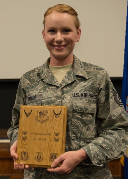 Tech. Sgt. Jasmin Taylor, 919th Special Operations Wing, displays her plaque as second quarter outstanding noncommissioned officer May 3 at Duke Field, Fla. Quarterly awards recognize individuals that exhibit high standards of performance through leadership and job performance, significant self-improvement, and base or community involvement. (U.S. Air Force photo/Tech. Sgt. Cheryl Foster)