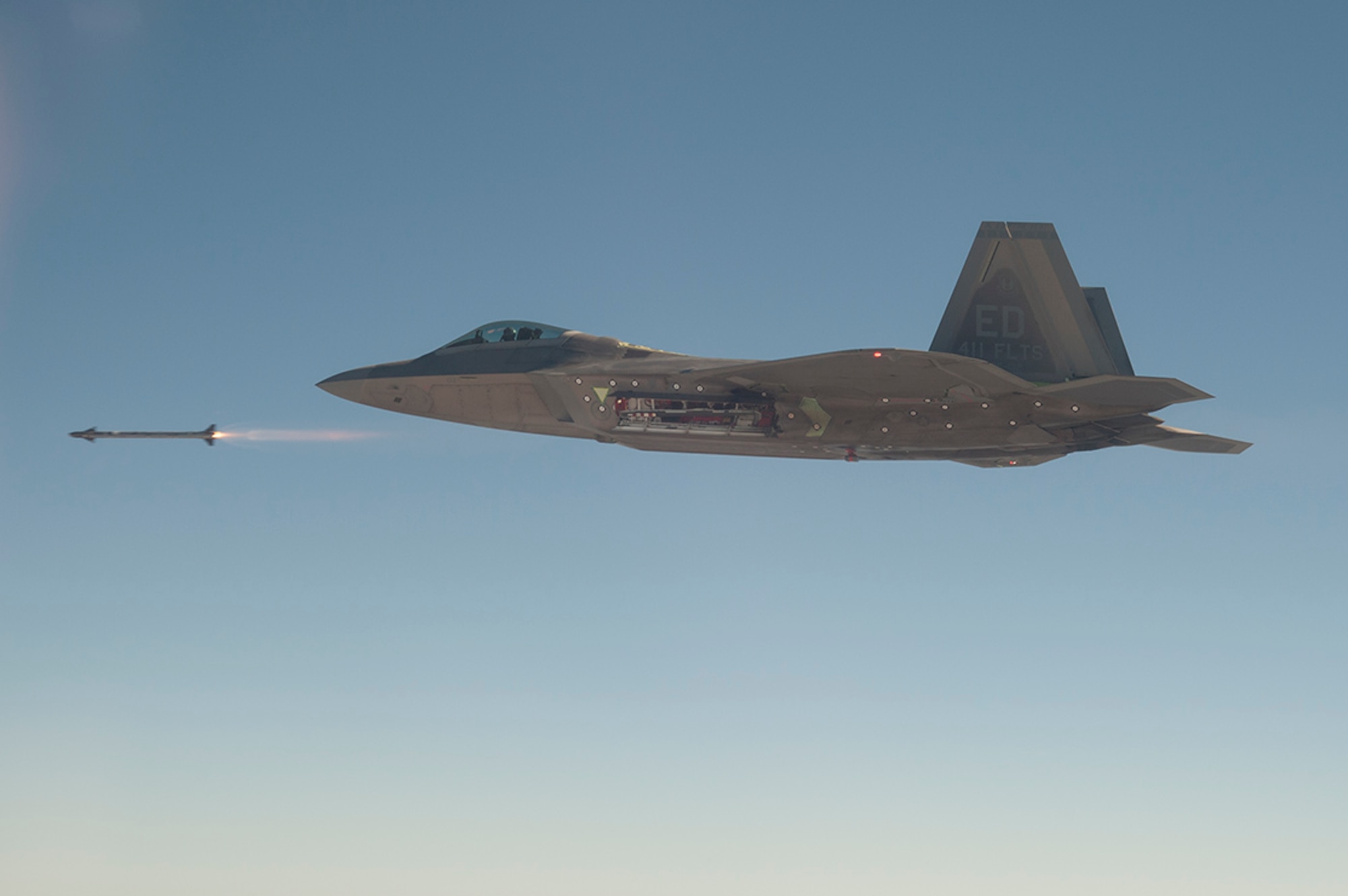 The first guided launch of the AIM-9X from an F-22 Raptor was Feb. 26, 2015, by Maj. Christopher Guarente, 411th FLTS assistant director of operations and F-22 test pilot. The AIM-9X is an advanced infrared missile and the newest of the Sidewinder family of short-range air-to-air missiles carried on a wide range of fighter jets. (Photo by David Henry/Lockheed Martin)
