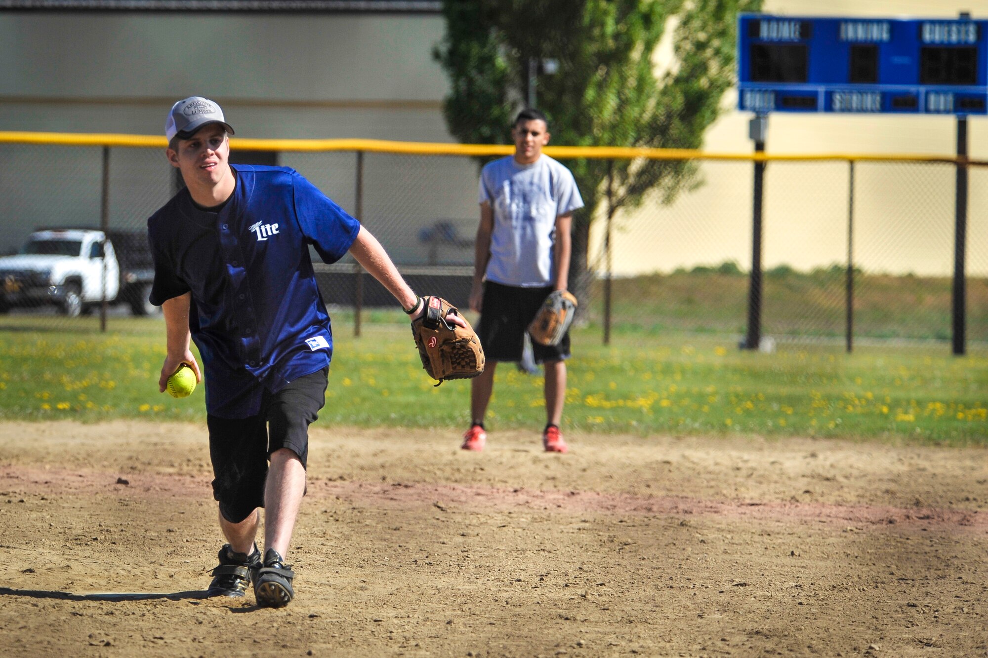 A 92nd Operations Group team member pitches a softball to the opposing team May 2, 2015, at the softball fields on Fairchild Air Force Base, Wash. With the tournament open to all Team Fairchild members, six teams were created and by the tournament’s end, the games came down to heated battle between the 336th Training Group and the 92nd Aircraft Maintenance Squadron with the aircraft maintainers taking the tournament with a crushing 18-8 win. (U.S. Air Force photo/Airman 1st Class Taylor Bourgeous)