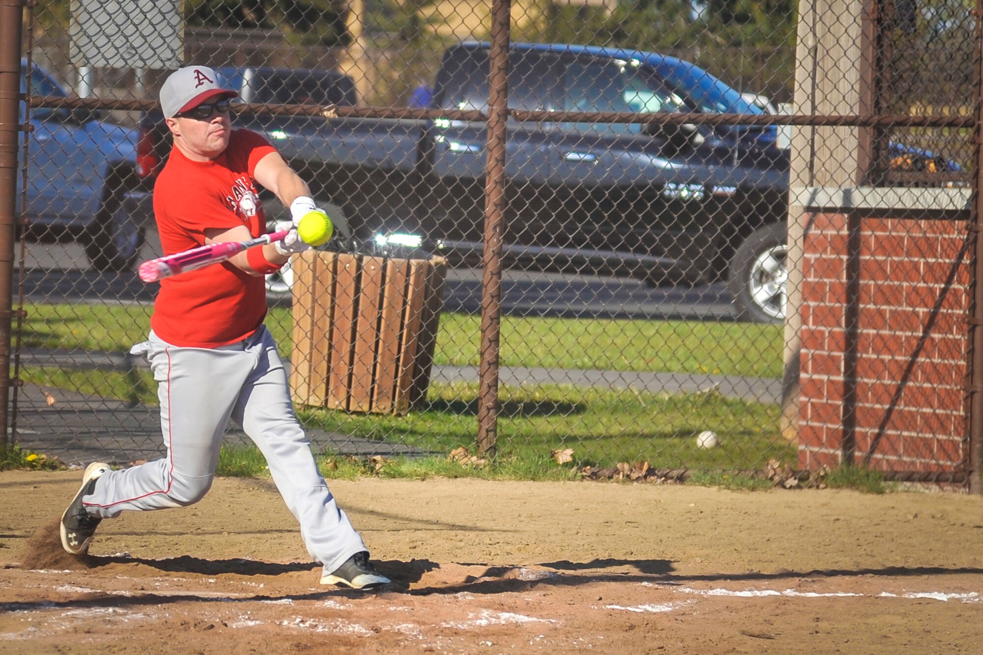A 92nd Maintenance Squadron team member swings and hits a softball May 2, 2015, at the softball fields on Fairchild Air Force Base, Wash. Military members from across the base joined together forming six different teams including members from the 92nd Maintenance Squadron, 92nd Medical group, 92nd Aircraft Maintenance Squadron, 92nd Force Support Squadron, 92nd Operations Group and the 336th Training Group Airmen from the U.S. Air Force Survival School. (U.S. Air Force photo/Airman 1st Class Taylor Bourgeous)