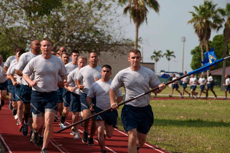 More than 100 Airmen from the 70th Aerial Port Squadron participate in a 5K on the track located behind the Sam Johnson Fitness Center at Homestead Reserve Base, Fla., May 2. The 70th APS participated in the Air Force wide Port Dawg 5K to honor Aerial Porters who lost their lives and build unit camaraderie. (U.S. Air Force photo by Senior Airman Aja Heiden)
