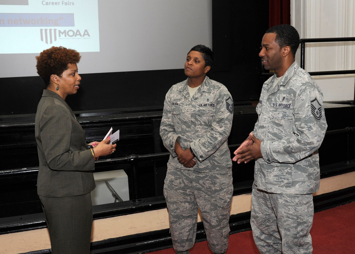 Terri Coles (left), Military Officers Association of America deputy director of transitions, discusses military transition with Master Sgt. Marissa Galvin and Master Sgt. Lawrence Cantrell, 59th Dental Training Squadron NCOs, April 28 after a “Marketing Yourself for a Second Career” seminar at the Joint Base San Antonio-Randolph Fleenor Auditorium. (U.S. Air Force photo by Harold China)