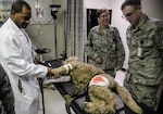 Attendees tour the 59th Medical Wing Simulation Center during the open house April 14 at Wilford Hall Ambulatory Surgical Center, on Joint Base San Antonio-Lackland. The dog manikin was created to enhance the training of security forces members who may have to treat a broken bone or give their miltary working dog an IV. (U.S. Air Force photo by Staff Sgt. Michael Ellis)