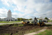 Members of the 502nd Civil Engineer Squadron from Joint Base San Antonio-Fort Sam Houston operate front end loaders to level the surface on the JBSA-Randolph Washington Circle star March 25. Previously shaped from yaupon holly shrubbery, the star will soon become a distinctive hardscape to reduce maintenance needs and increase water conservation.   (U.S. Air Force photo by Joel Martinez/Released)