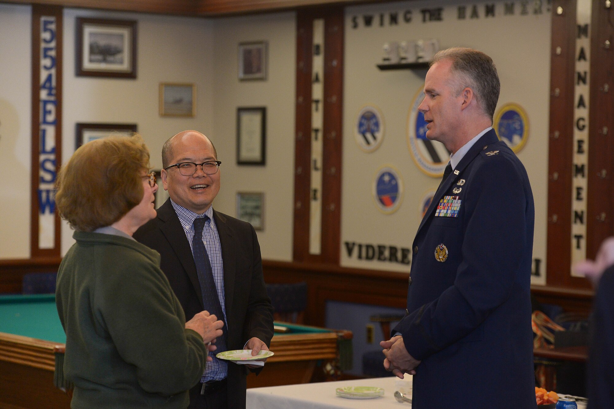 Col. Michael A. Vogel, 66th Air Base Group commander, speaks with Nancy Nelson, Minute Man National Park superintendent, and Steve Ng, Concord Selectman, during the Community Leader Update at Hanscom Air Force Base, Mass., May 5, 2015. The CLU is held twice a year and provides an opportunity for Hanscom leadership and community leaders to exchange information on recent changes and upcoming events on base and in the surrounding towns. (U.S. Air Force photo by Jerry Saslav)