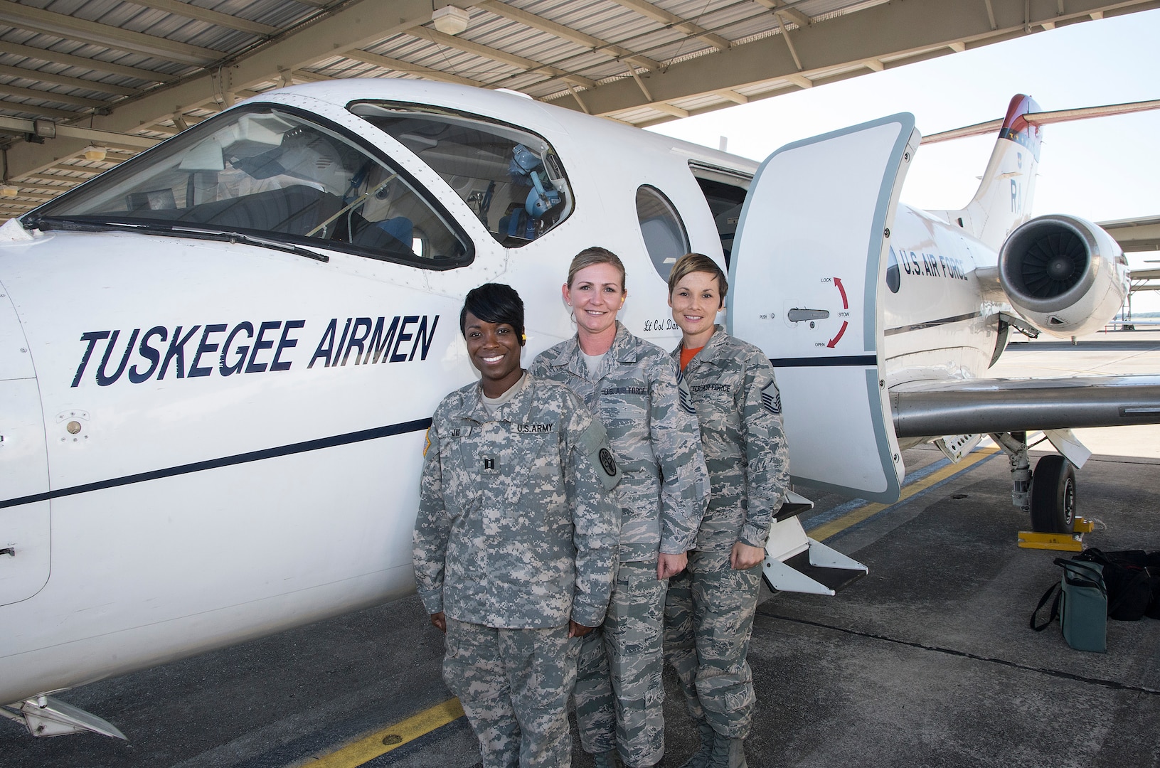 Left to right: Capt. Jacqueline Just, chief admissions and dispositions at JBSA-Fort Sam Houston; Chief Master Sgt. Katie McCool, 323rd Training Squadron superintendent at JBSA-Lackland; Master Sgt. Nicole Hicks, Air Force Personnel Center mission support assignments NCO in charge at JBSA-Randolph, are working with staff members from the JBSA Sexual Assault and Prevention Response Program and using their voices to advocate and help members throughout JBSA. The three were provided a survivors’ flight in a T-1 Jayhawk May 1 by the 12th Flying Training Wing at JBSA-Randolph. (U.S. Air Force photo by Johnny Saldivar)