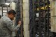 Senior Airman William Seagle and Staff Sgt. Evan Dwarshuis troubleshoot a phone line on Joint Base Andrews, Md., April 30, 2015. Both Airmen are 744th Communications Squadron Telephone Shop cyber transport technicians. (U.S. Air Force photo/Master Sgt. Tammie Moore)