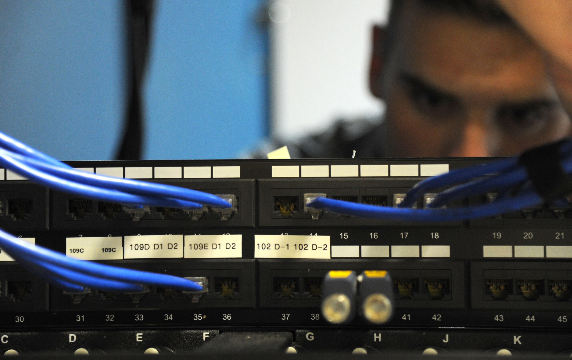 Senior Airman Christopher Anderson checks a network connection at the 11th Civil Engineer Squadron on Joint Base Andrews, Md., April 30, 2015. Anderson is a 744th Communications Squadron cable maintenance technician. (U.S. Air Force photo/Master Sgt. Tammie Moore)