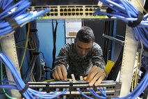 Senior Airman Christopher Anderson checks a network connection at the 11th Civil Engineer Squadron on Joint Base Andrews, Md., April 30, 2015. Anderson is a 744th Communications Squadron cable maintenance technician. (U.S. Air Force photo/Master Sgt. Tammie Moore)