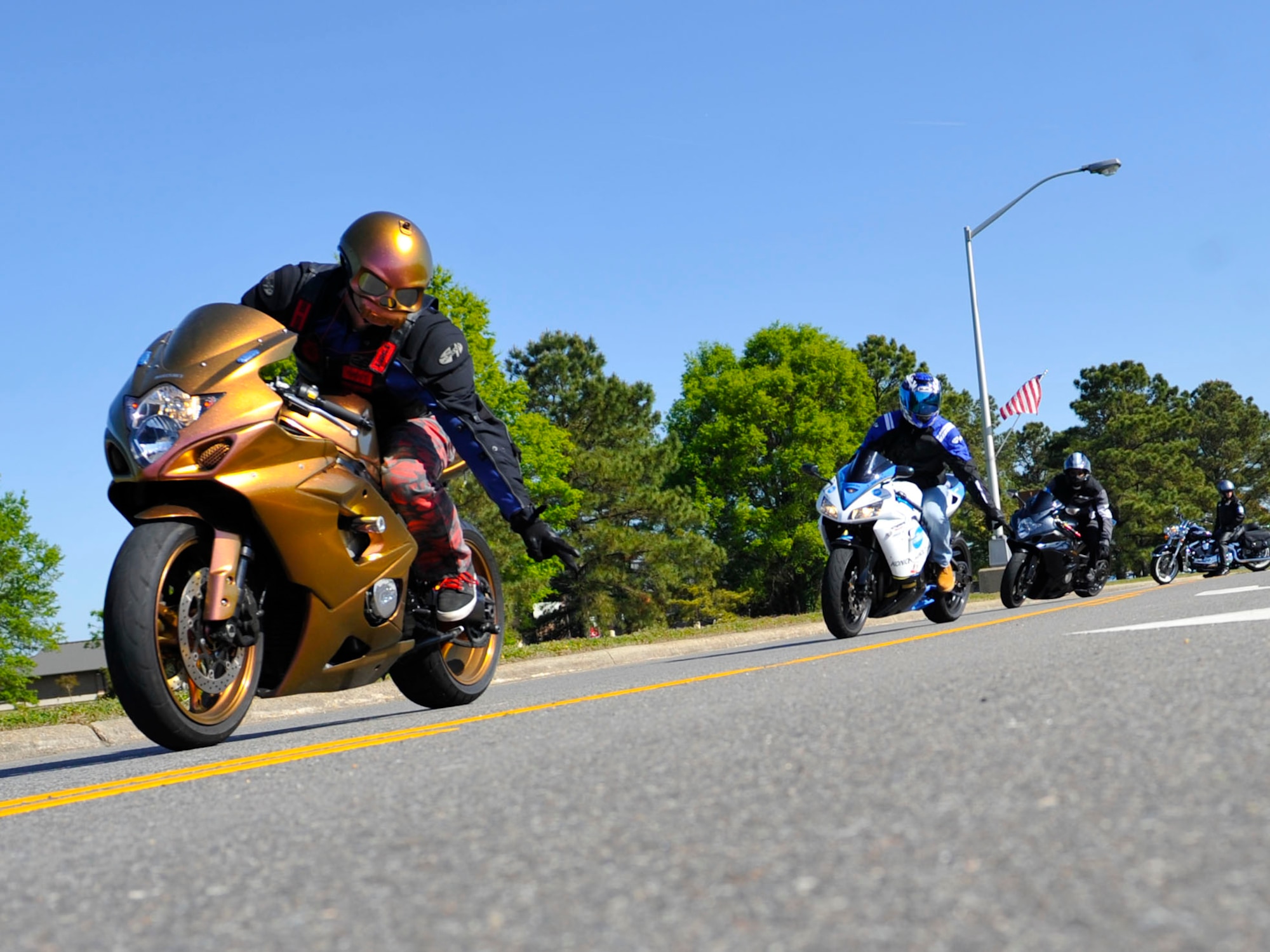 Motorcyclists depart for a 35-mile ride to Surry, Va., during the 4th Annual Standing Together Against Rape Road Rally at Langley Air Force Base, Va., April 29, 2015. For the month of April, the Sexual Assault and Prevention Response team held theater performances, meet and greets with victim advocates, a poetry slam and other activates to promote sexual assault awareness.  (U.S. Air Force photo by Senior Airman Breonna Veal/Released)