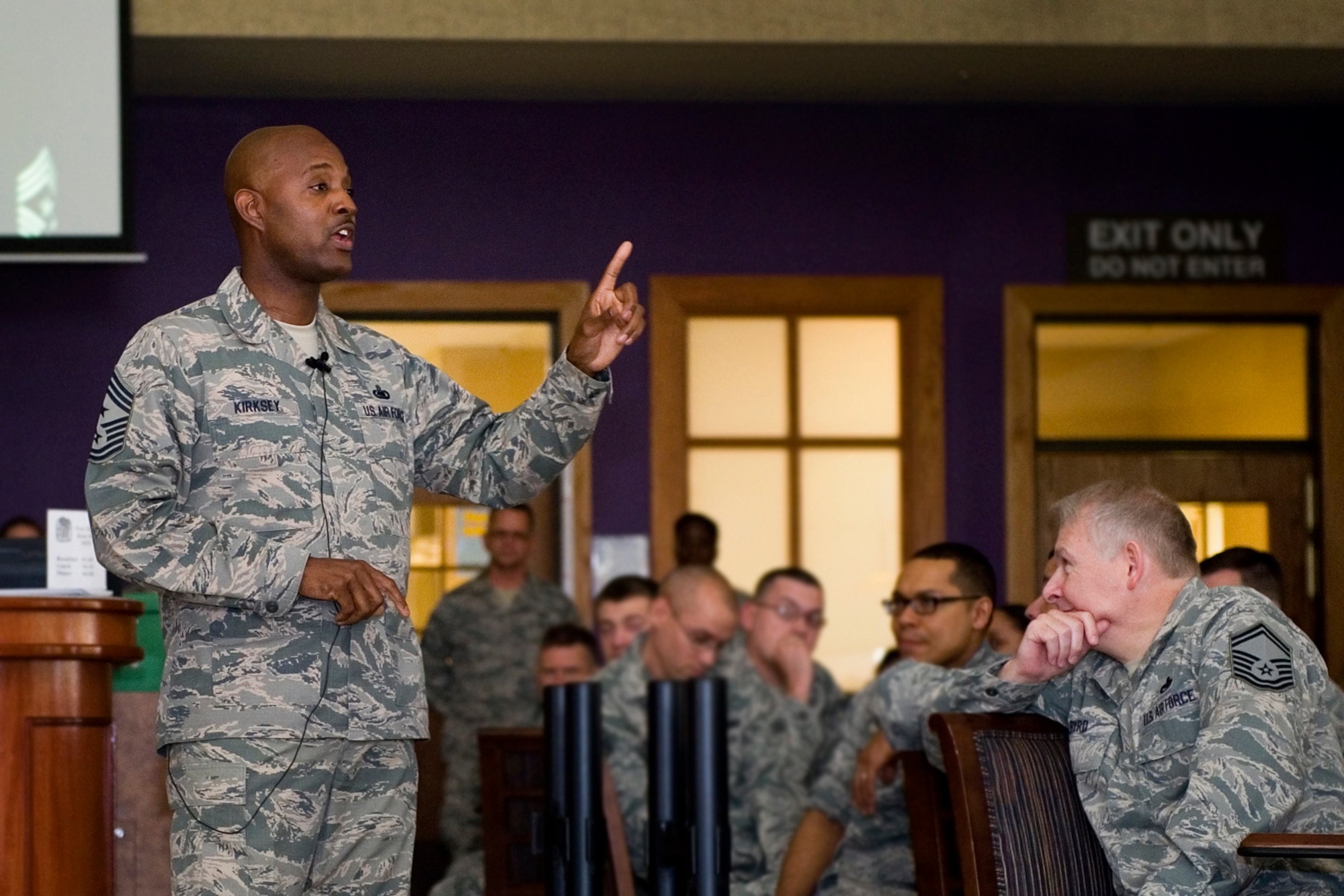 Chief Master Sgt. Cameron Kirksey, Air Force Reserve Command command chief master sergeant, speaks to Airmen during an all-call at Grissom Air Reserve Base, Ind., May 3, 2015. Kirksey serves as the direct link between the enlisted force, advising Lt. Gen. James Jackson, Chief of Air Force Reserve and AFRC commander, on matters concerning the health, morale, and welfare of AFRC?s enlisted force. (U.S. Air Force photo/Senior Airman Jami Lancette)