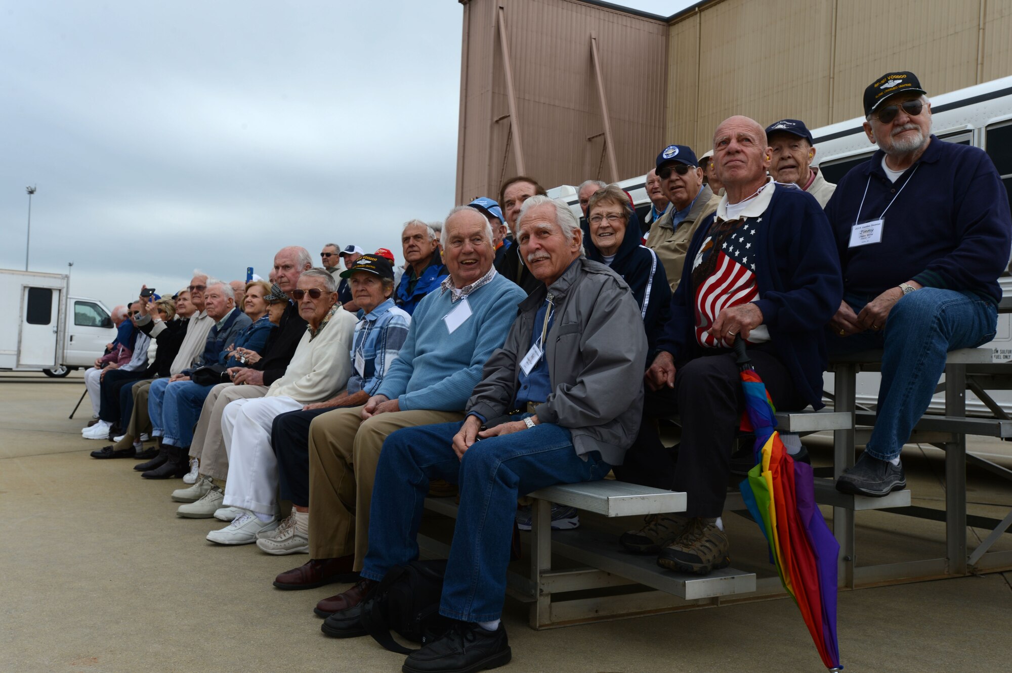 The last of the RF-101 Voodoo pilots watch the F-16 Viper Demo Team at Shaw Air Force Base, S.C., April 29, 2015. The pilots held their final large reunion in Sumter S.C., visiting the base which supported the RF-101 for 43 years. (U.S. Air Force photo by Senior Airman Jensen Stidham/Released)