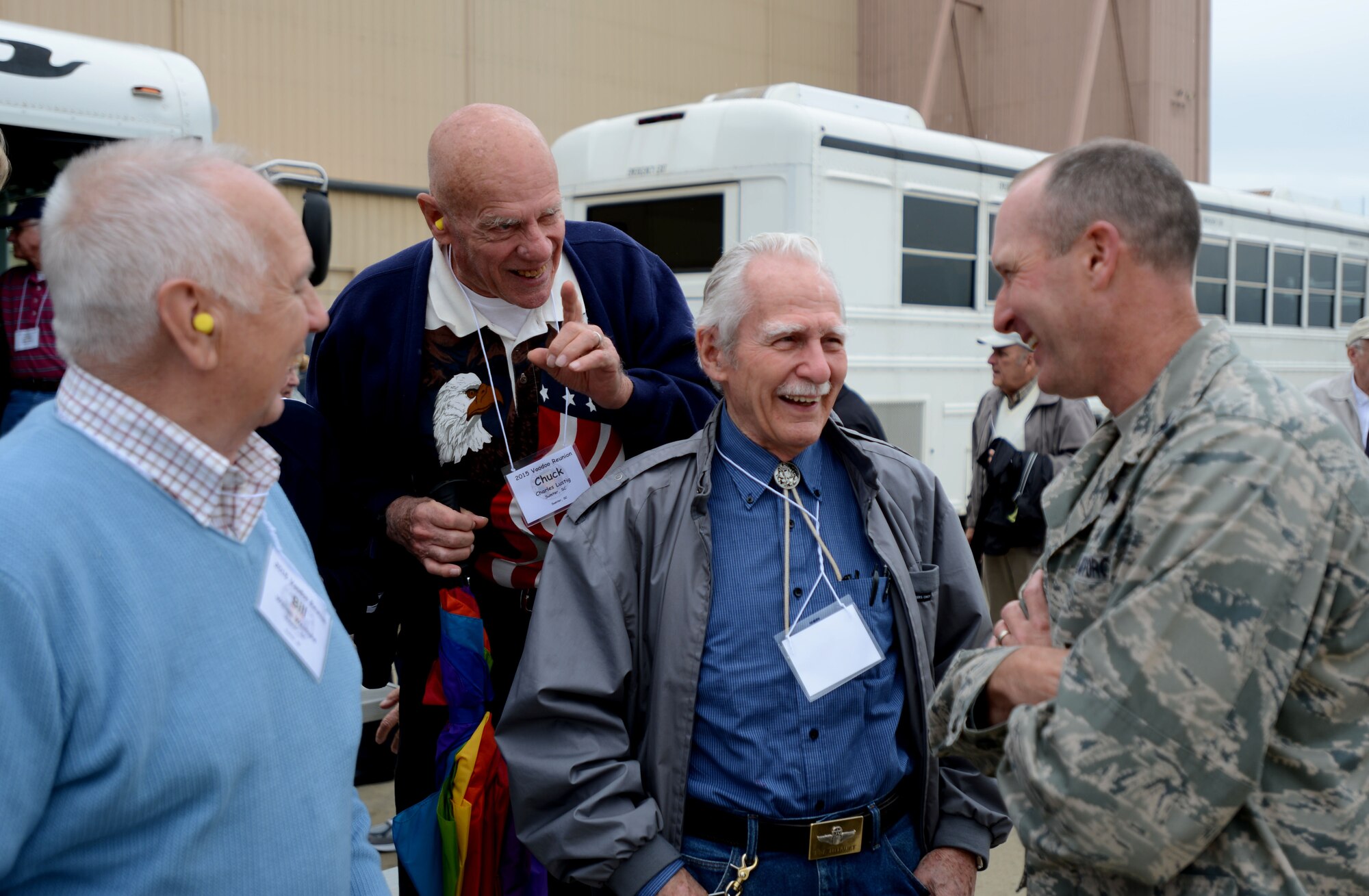 RF-101 Voodoo pilots talk to Col. Stephen Jost, 20th Fighter Wing commander, during their last large Voodoo reunion at Shaw Air Force Base, S.C., April 29, 2015. Throughout the reunion the pilots visited the base to watch the F-16 Viper Demo Team. (U.S. Air Force photo by Senior Airman Jensen Stidham/Released)