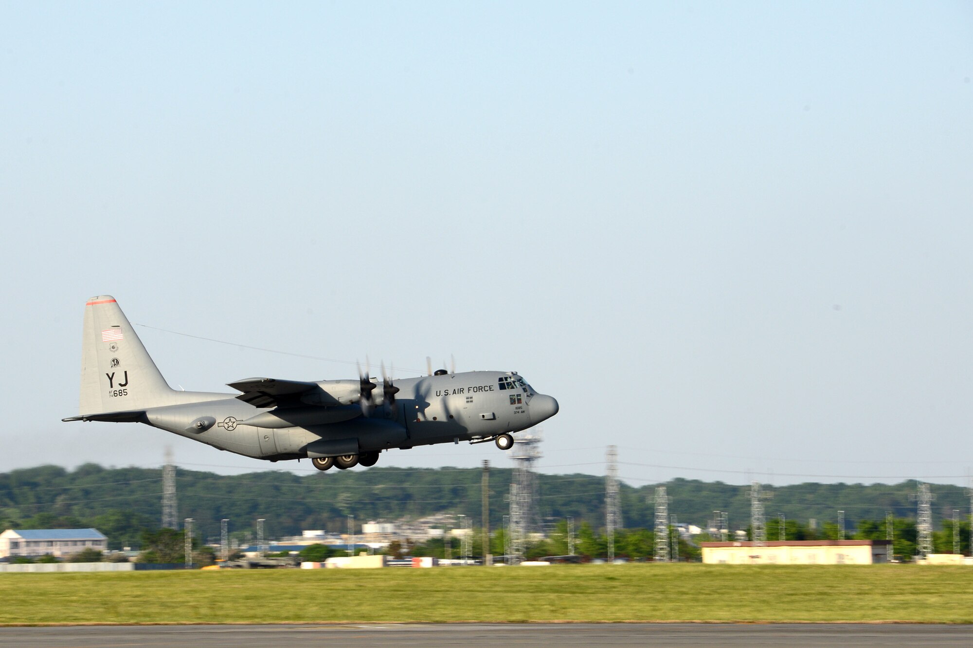 A C-130 Hercules takes off at Yokota Air Base, Japan, May 5, 2015. Members of Yokota left to provide humanitarian airlift and relief operations to support the U.S. Agency of International Development and the Government of Nepal in response to the 7.8 magnitude earthquake that devastated the country April 25, 2015. (U.S. Air Force photo by Staff Sgt. Cody H. Ramirez/Released)