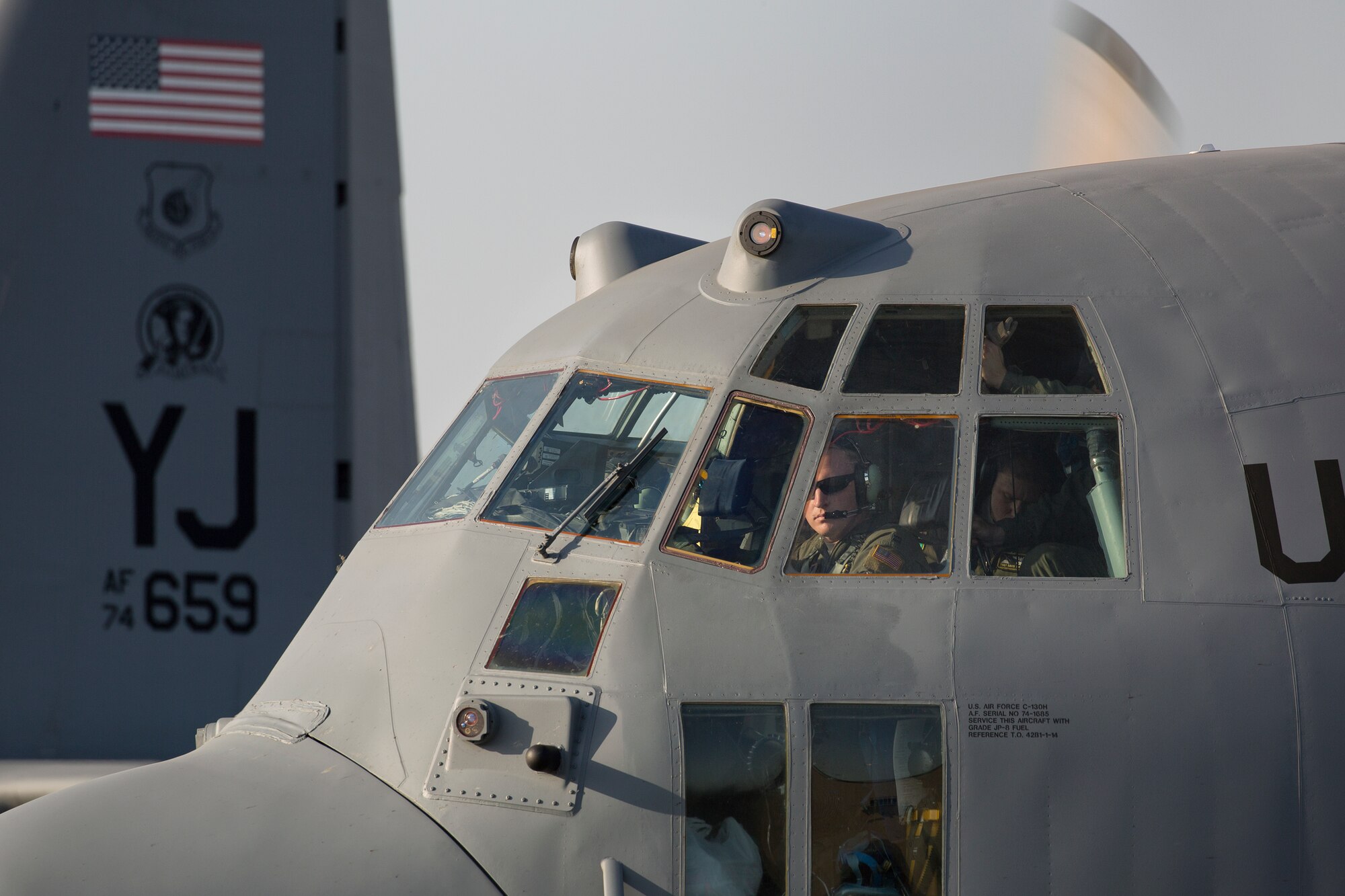 Capt. Christopher Weaver, 36th Mobility Response Squadron pilot, conducts preflight checks at Yokota Air Base, Japan, May 5, 2015. Airmen departed Yokota to support the U.S. Agency of International Development and the Government of Nepal.  (U.S. Air Force photo by Osakabe Yasuo/Released)