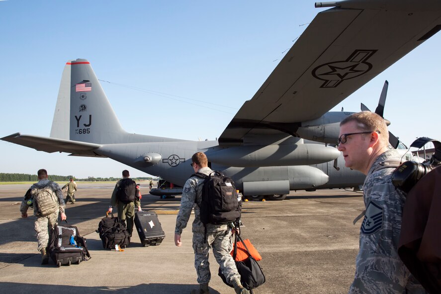 Yokota airmen board a C-130 Hercules at Yokota Air Base, Japan, May 5, 2015.    Airmen departed to conduct humanitarian assistance and disaster relief operations in support of the Government of Nepal in the wake of a 7.8 magnitude earthquake that devastated many regions of the country on April 25, 2015. (U.S. Air Force photo by Osakabe Yasuo/Released) 