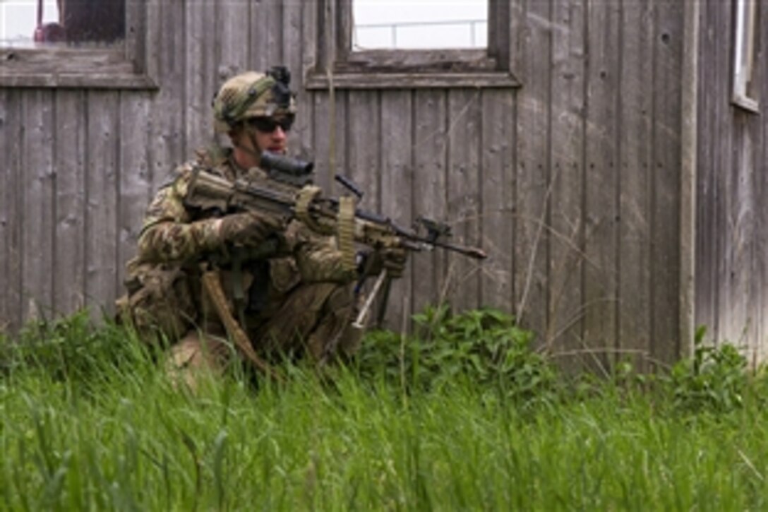 U.S. Army Pvt. Devon Minardo provides security during a training exercise on the Hohenfels Training Area in Bavaria, Germany, May 5, 2015. Minardo is assigned to the 3rd Infantry Division’s 69th Armor Regiment, 1st Armored Brigade Combat Team.