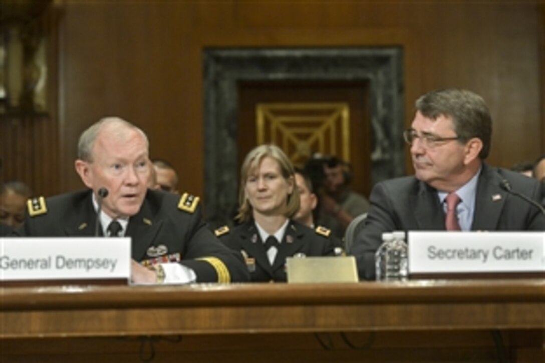 Defense Secretary Ash Carter looks on as Army Gen. Martin E. Dempsey, chairman of the Joint Chiefs of Staff, answers questions as they testify before the Senate Appropriations Committee's defense subcommittee in Washington, D.C., May 6, 2015.