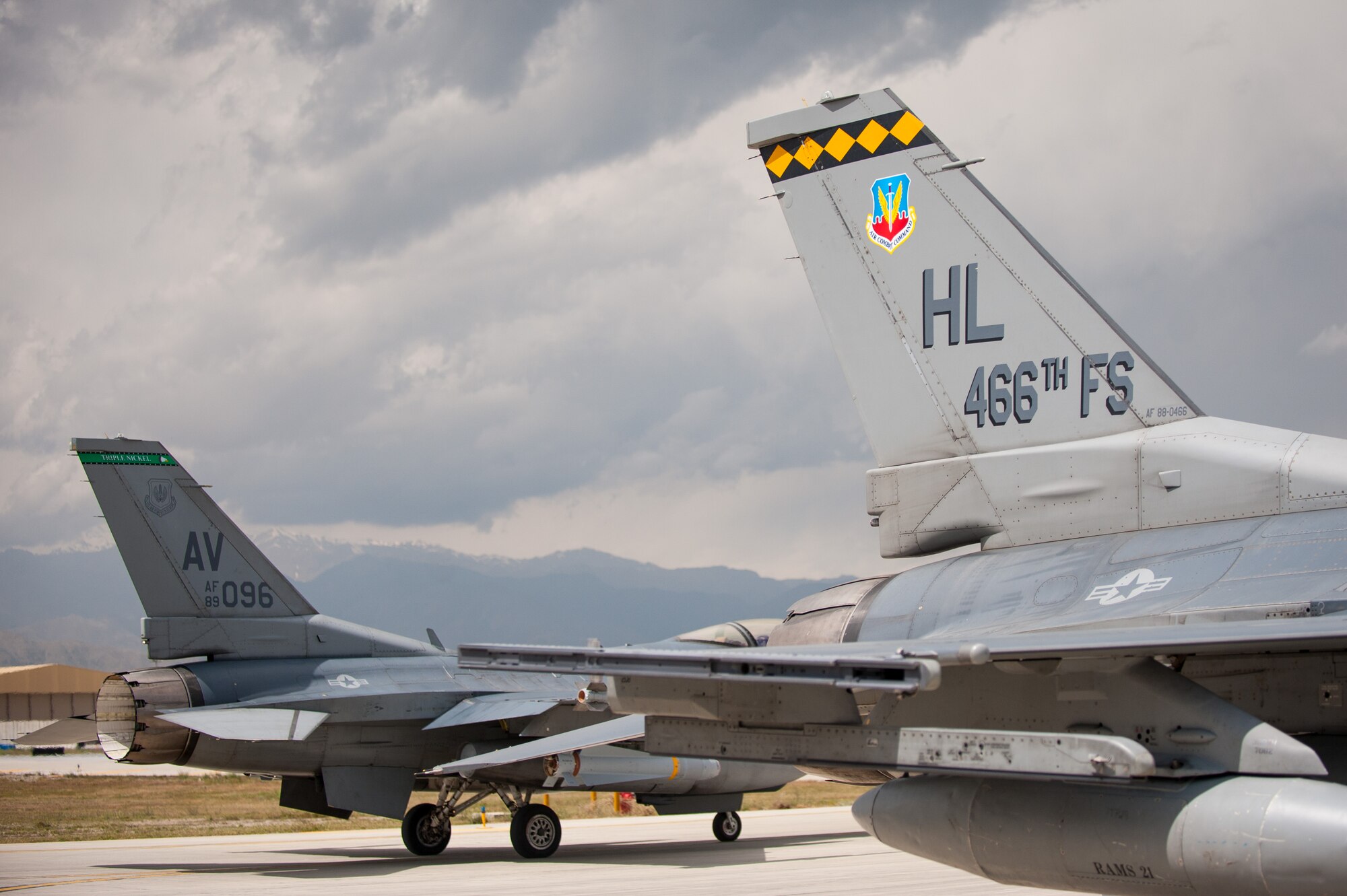 An F-16 Fighting Falcon aircraft, assigned to the 4th Fighter Squadron from Hill Air Force Base, Utah, prepares to to leave Bagram Airfield, Afghanistan, as one of its replacement an F-16, assigned to the 555th Fighter Squadron, from Aviano Air Base, Italy, taxis behind it, April 30, 2015. The “Fuujins” of the 4th FS provided decisive airpower to ground commanders in Afghanistan throughout their six month deployment, flying more than 8,000 hours in the F-16 in support of operations Enduring Freedom and Freedom’s Sentinel. (U.S. Air Force photo by Tech. Sgt. Joseph Swafford/Released)