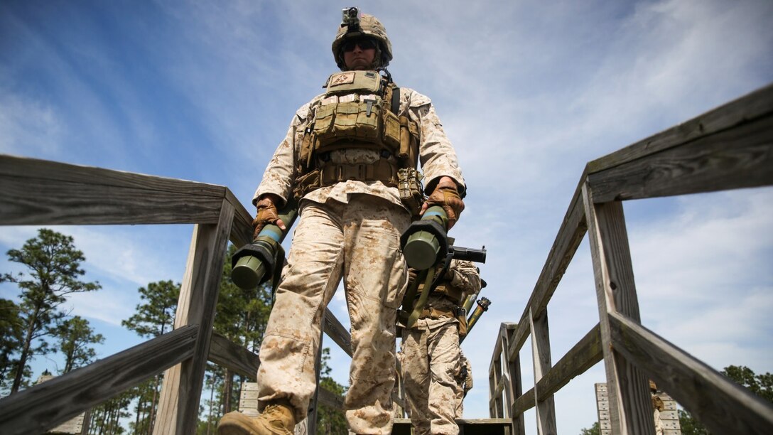 Marines with 1st Battalion, 8th Marine Regiment exit the firing line after shooting  Mk-153 shoulder-launched multipurpose assault weapons during a live-fire rocket range aboard Marine Corps Base Camp Lejeune, North Carolina, May 5, 2015. The purpose of the exercise was to build confidence, camaraderie and weapon proficiency throughout the unit. (U.S. Marine Corps photo by Cpl. Kirstin Merrimarahajara/released)